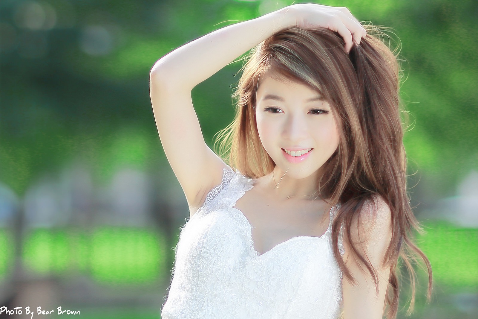 Asian woman in white dress with hand in hair HD Wallpaper