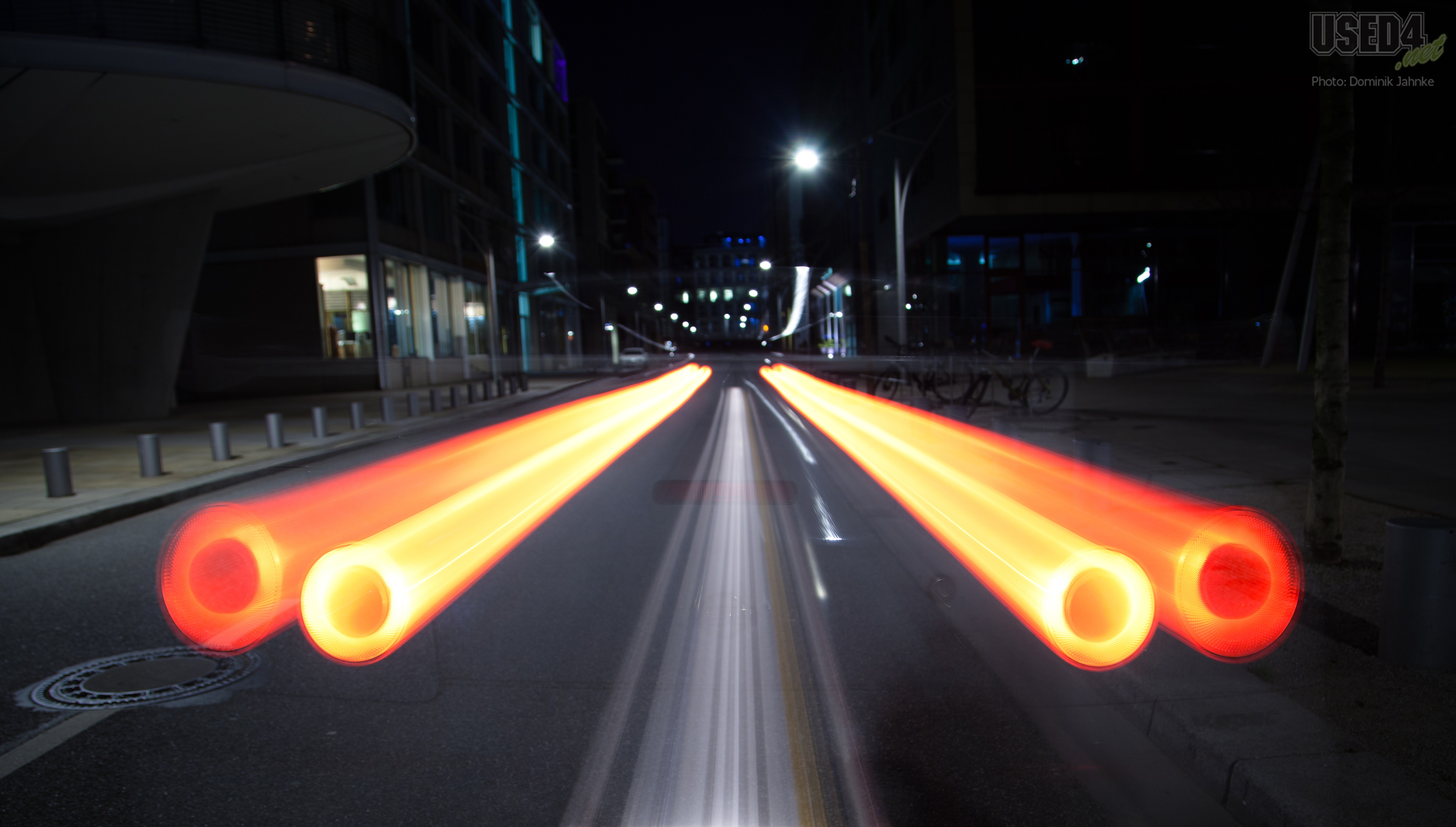 Light trails on a street at night HD Wallpaper