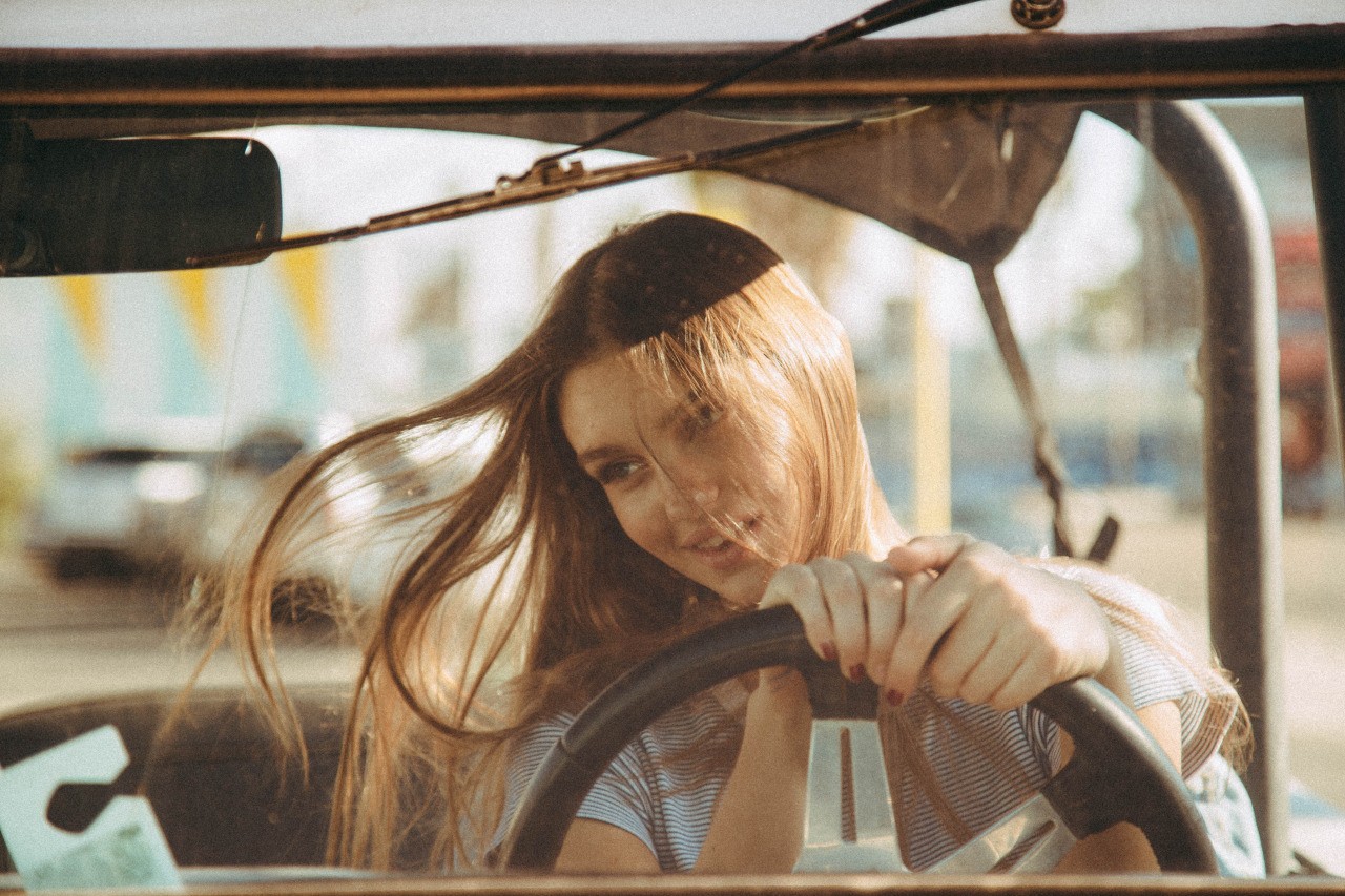 Olivia Brower driving a car HD Wallpaper