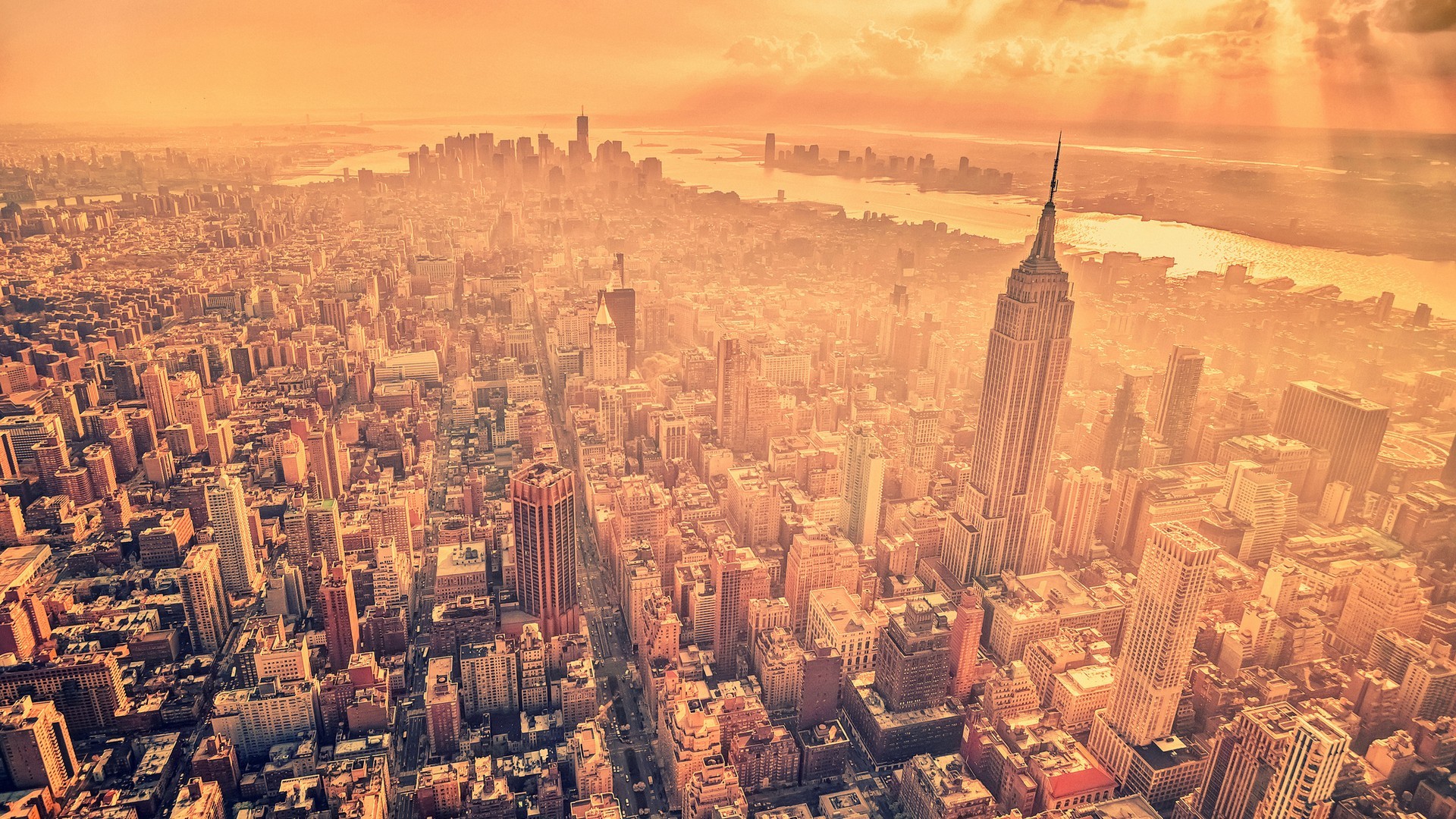 New York City skyline with Empire State Building at sunset HD Wallpaper