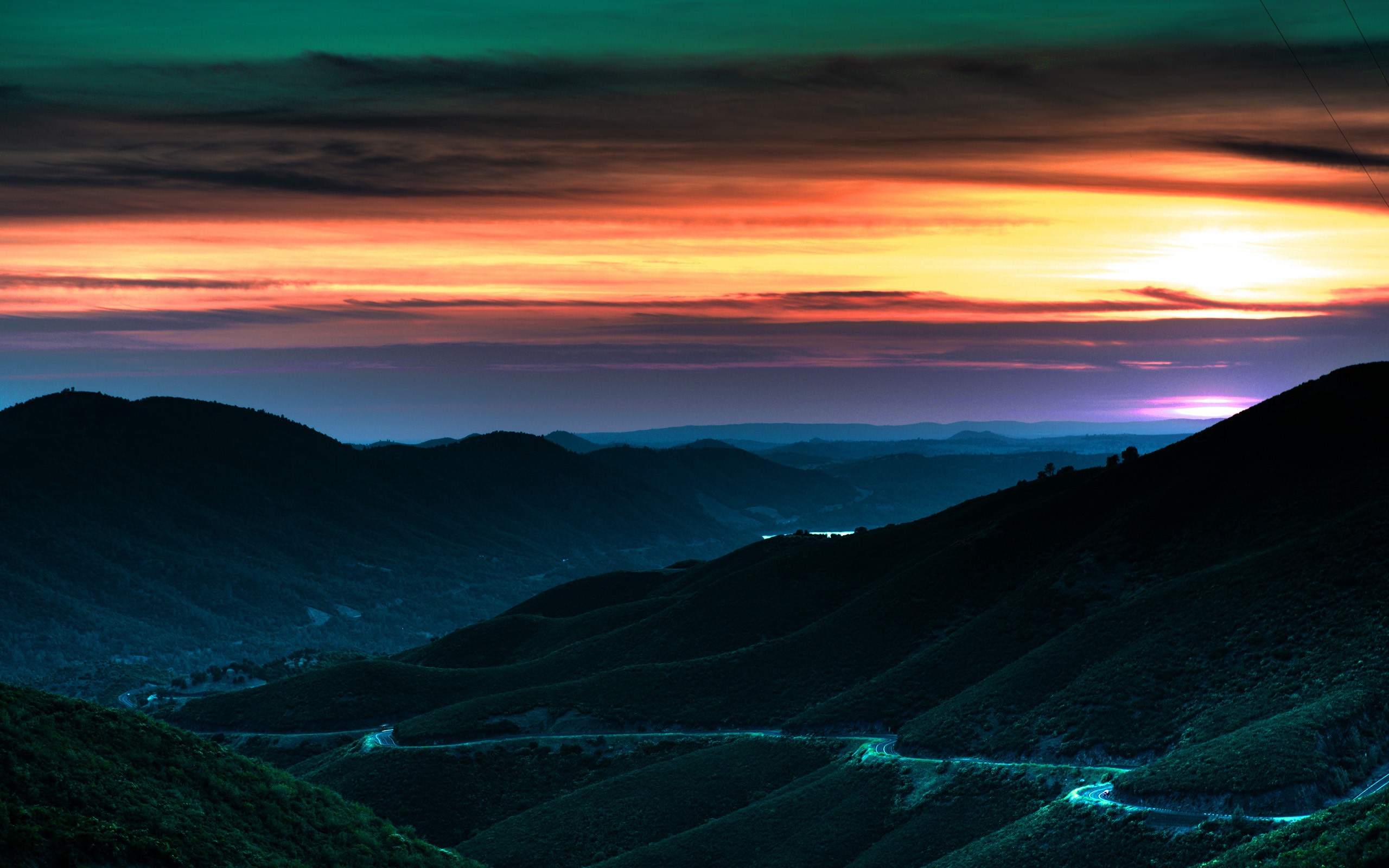 Road through mountains at sunset HD Wallpaper