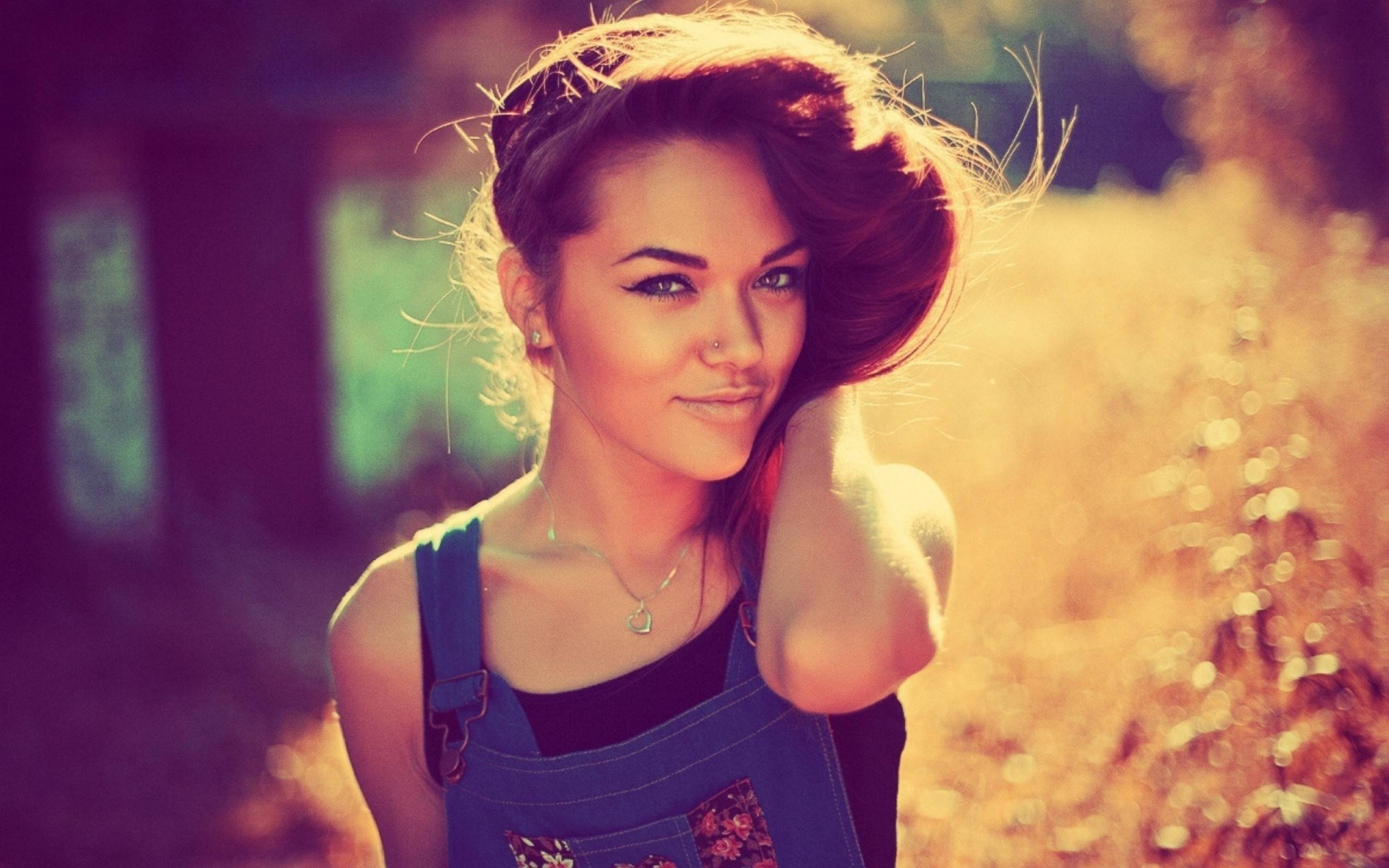 Woman with pierced nose wearing overalls outdoors HD Wallpaper