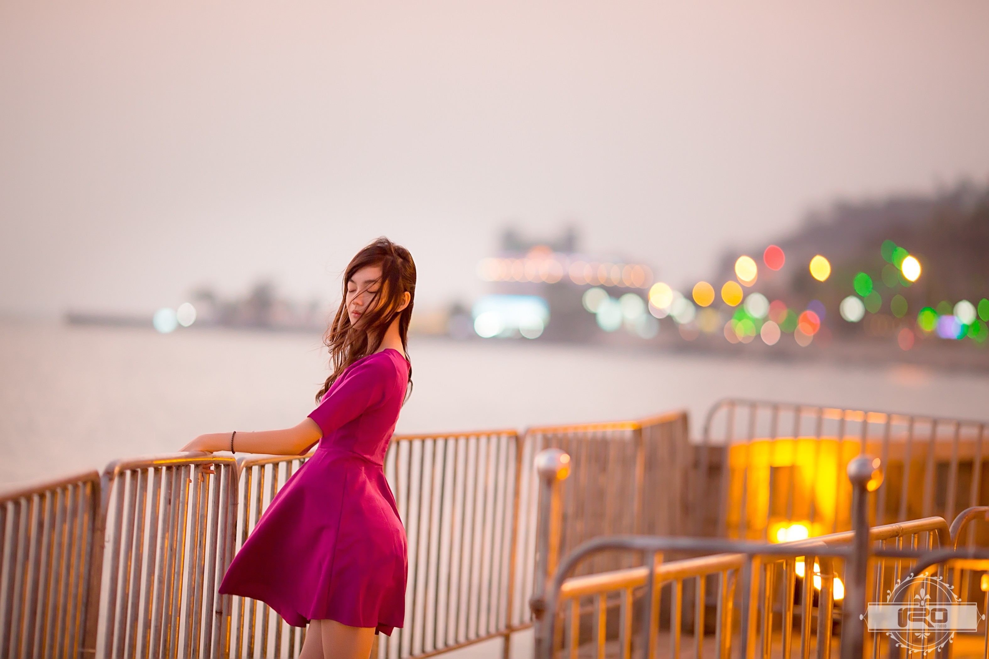 Asian woman in a pink dress by the water HD Wallpaper