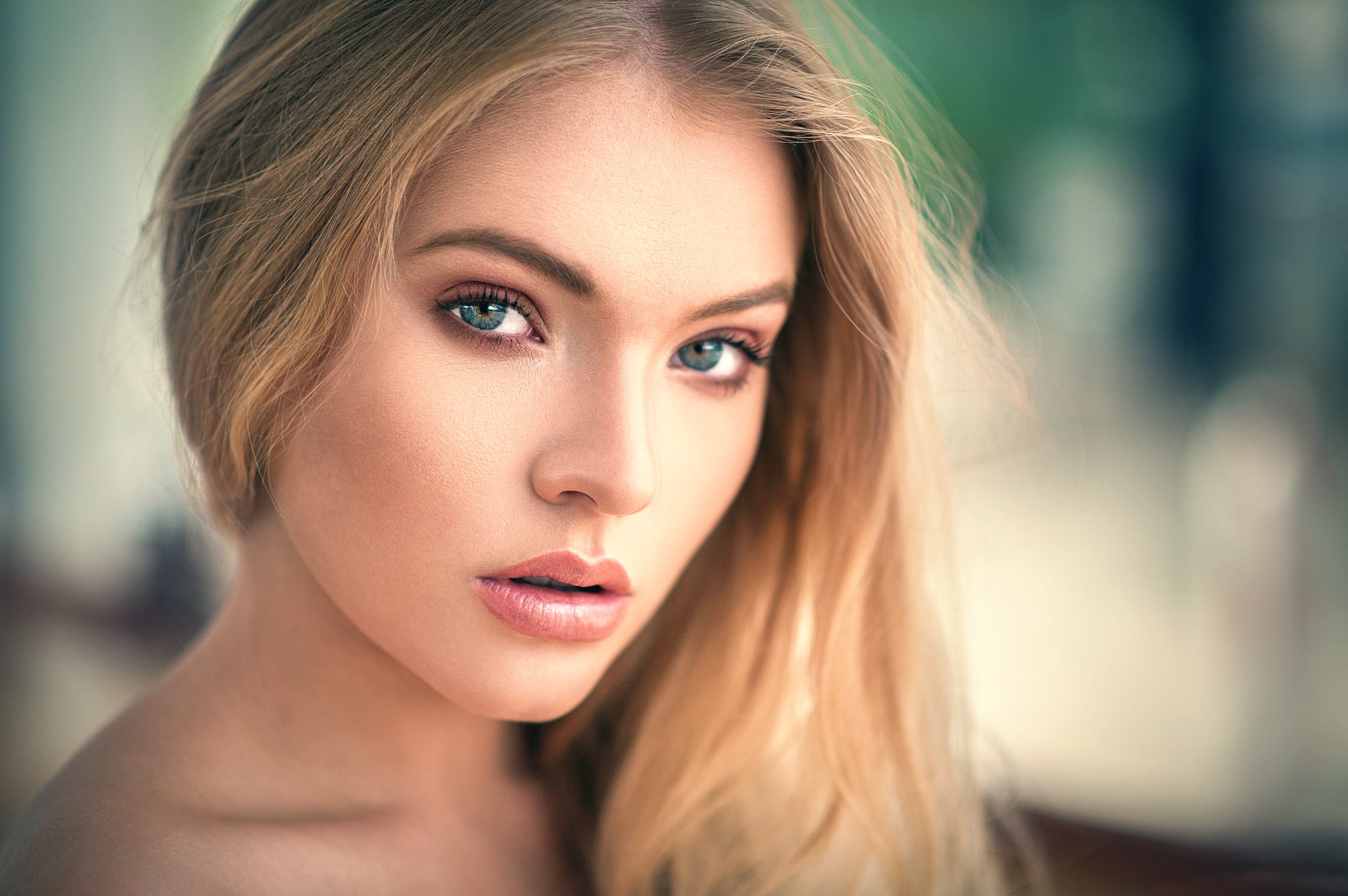 Portrait of a blonde woman looking at the viewer HD Wallpaper