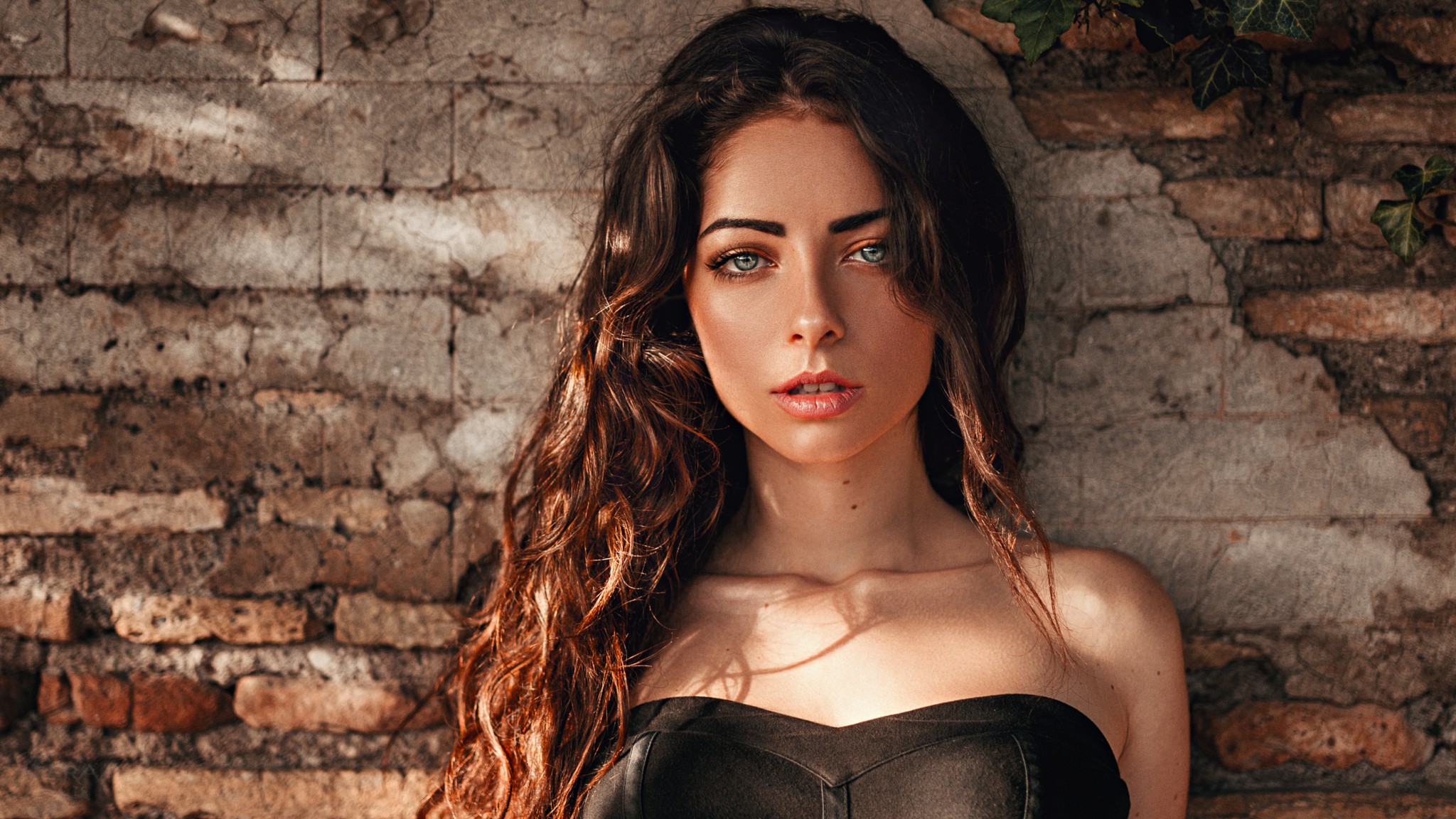 Portrait of a woman with long wavy hair by Georgy Chernyadyev HD Wallpaper