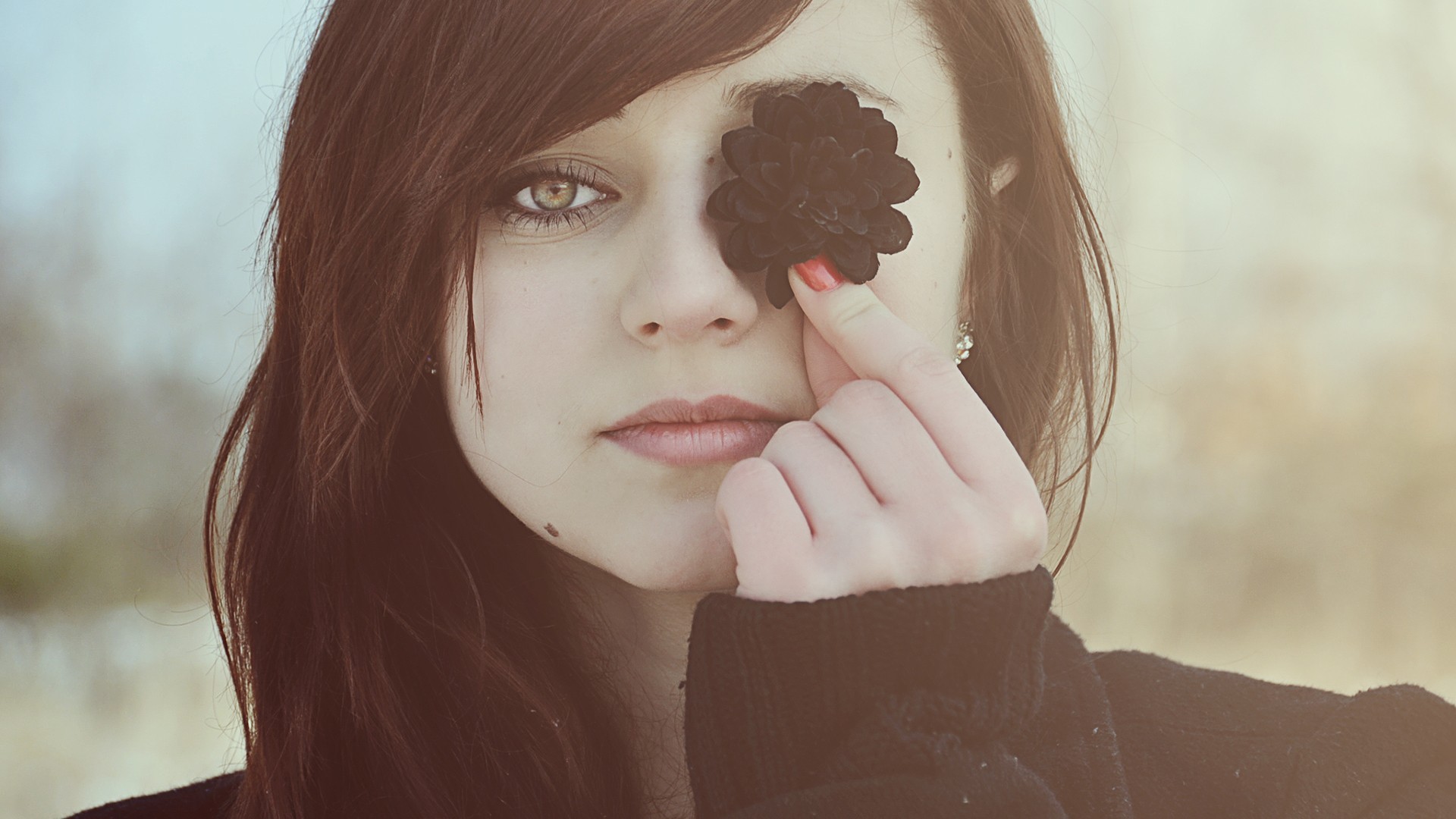 Woman holding a black flower over her eye HD Wallpaper