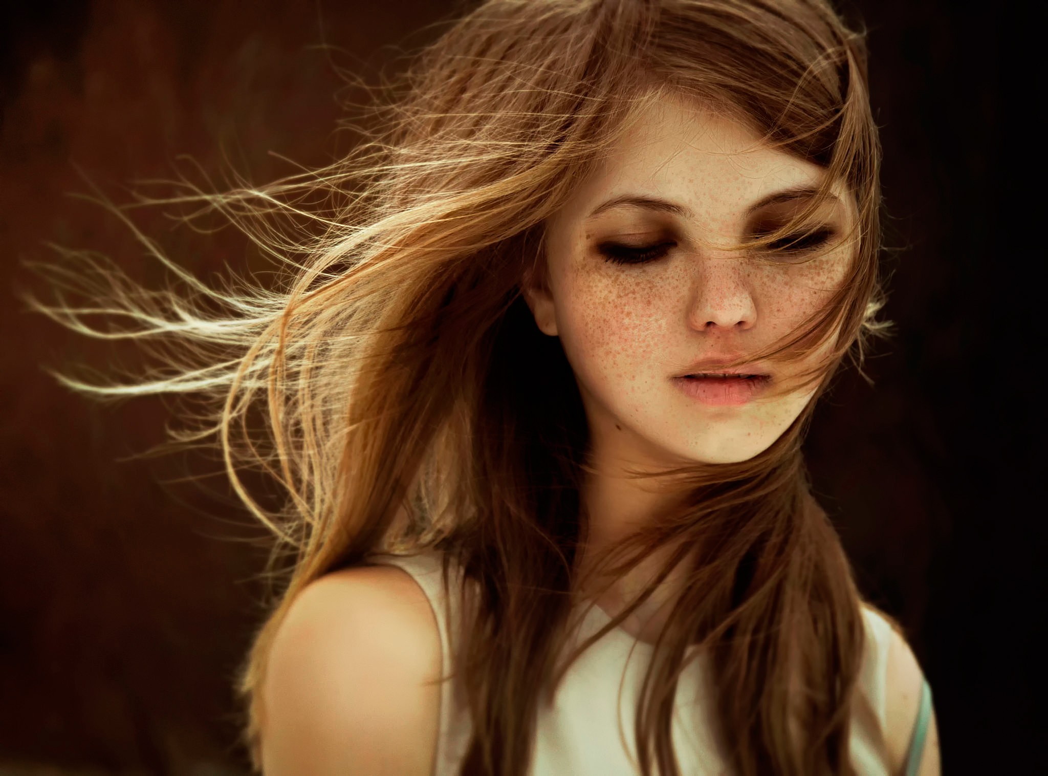 Woman with freckles and windblown hair HD Wallpaper