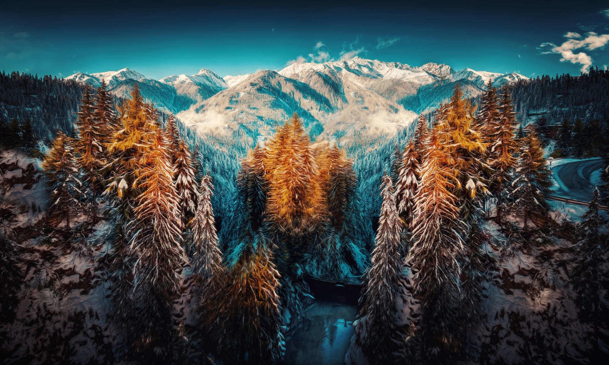 Snowy mountains and forest with a winding road HD Wallpaper