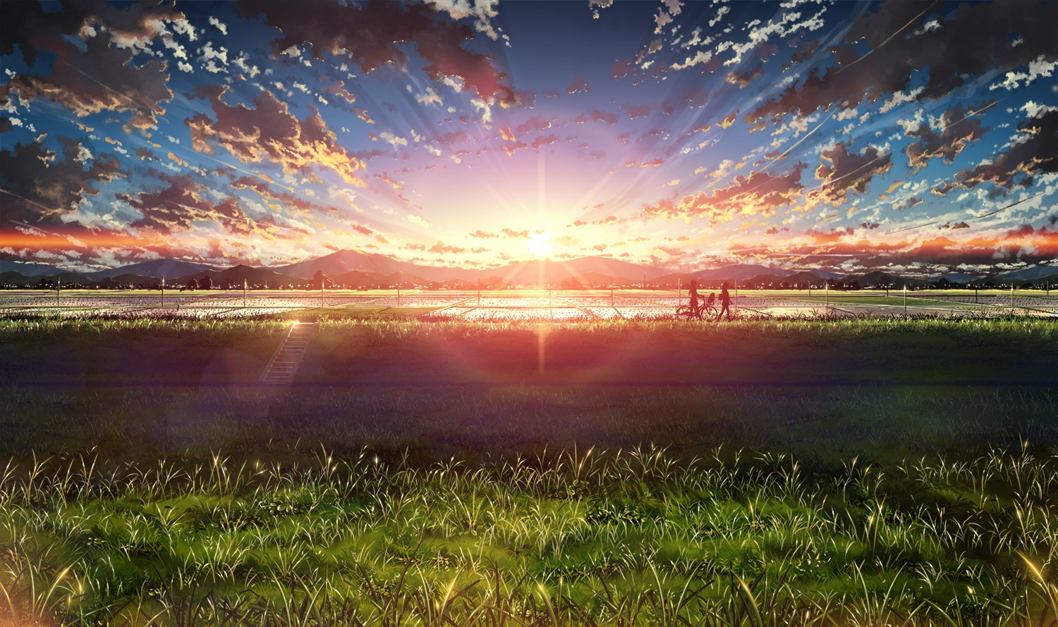 Sunset over a rural landscape with two people on bicycles HD Wallpaper