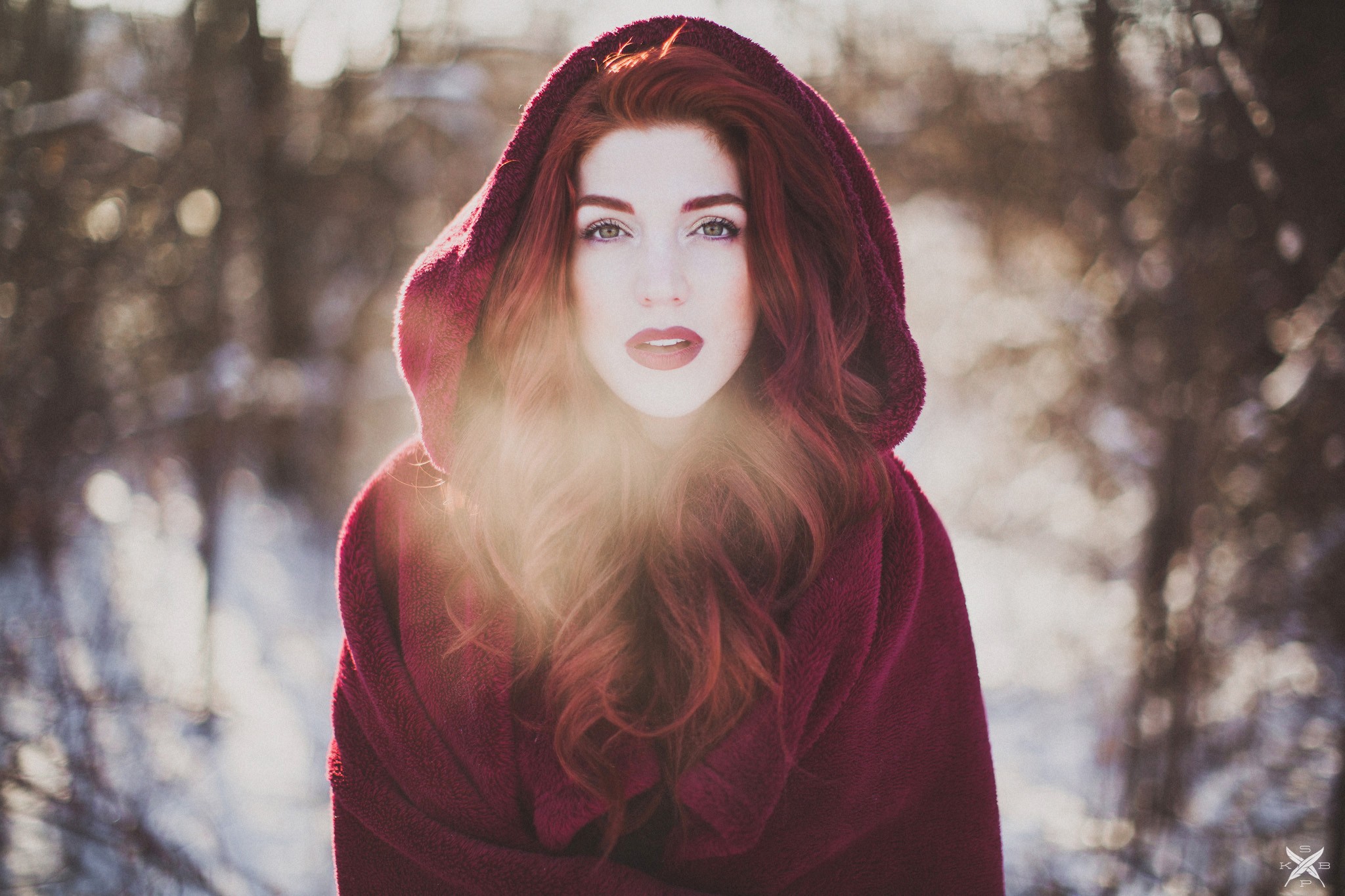 Redhead woman in red hood in winter forest HD Wallpaper