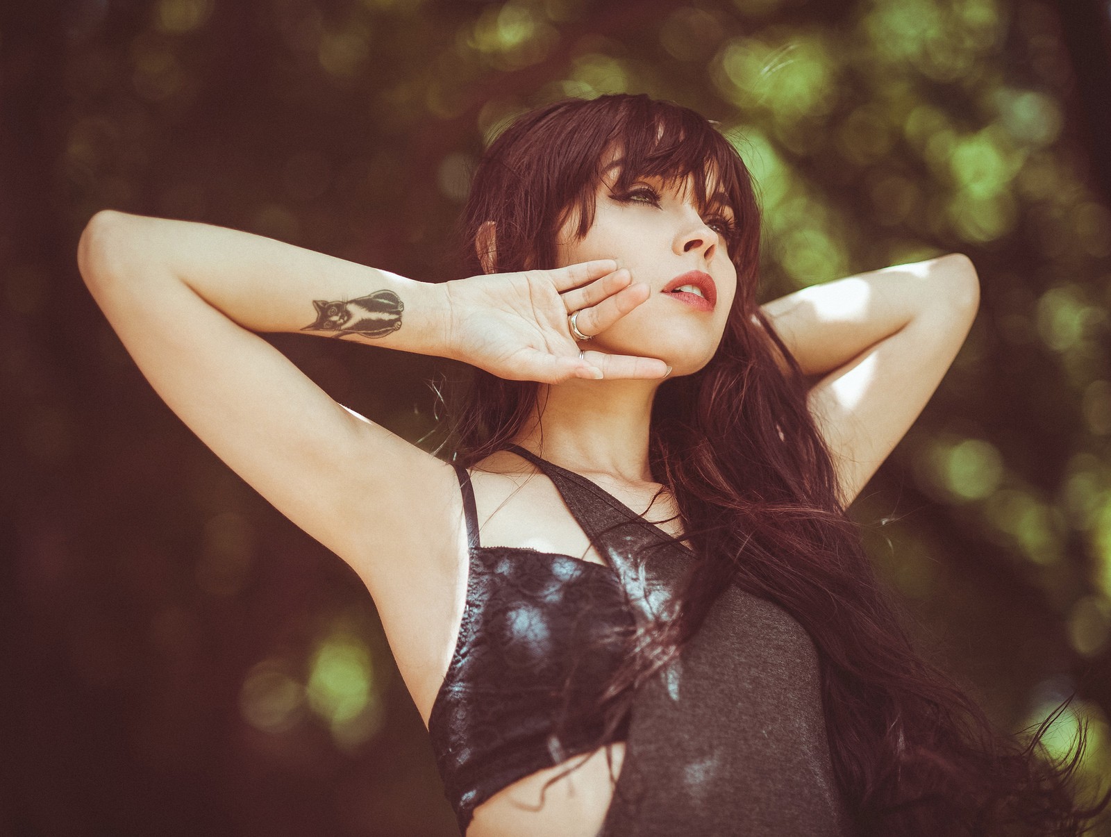 Woman with tattoo and ring looking away HD Wallpaper