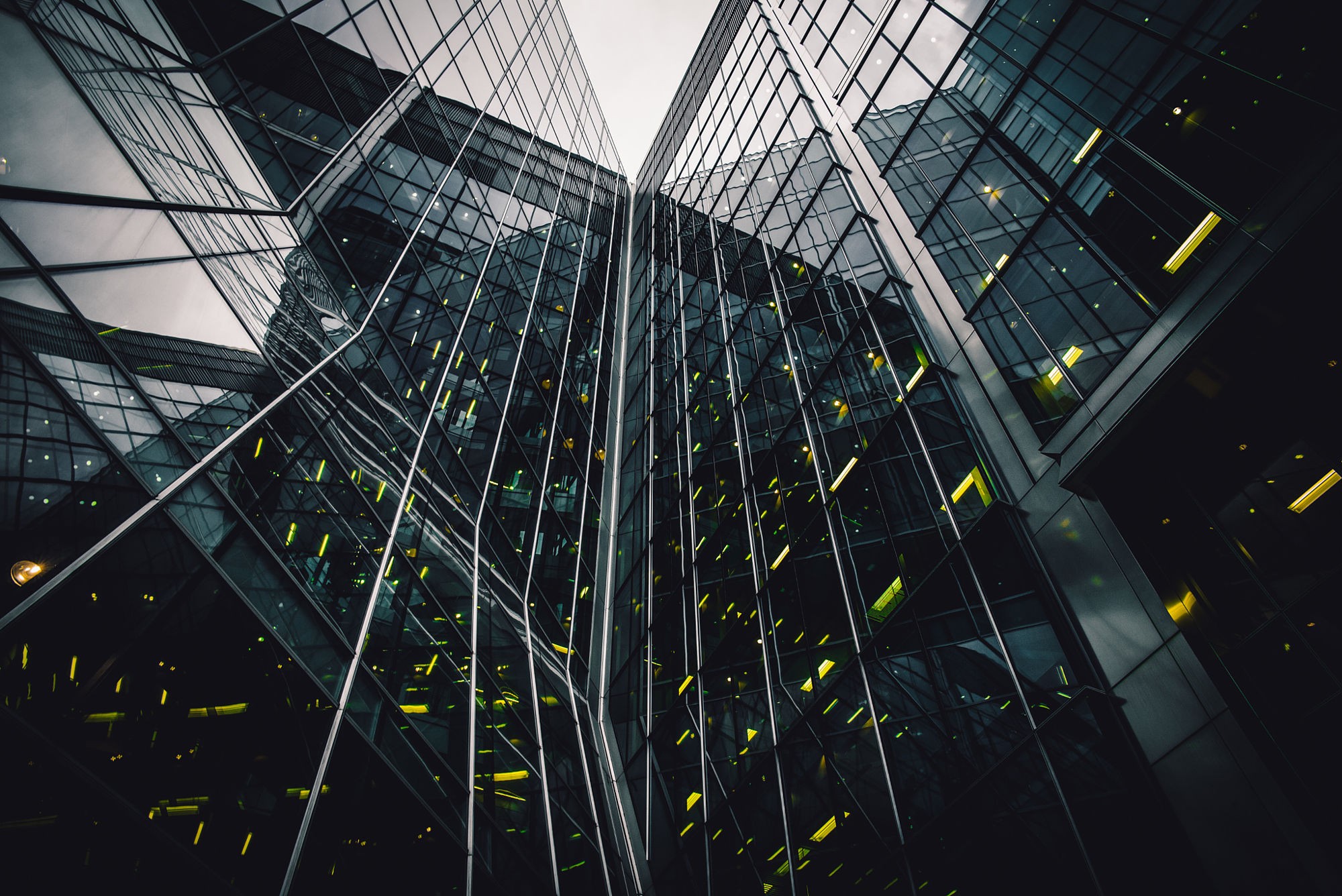 Modern glass buildings reflecting the sky HD Wallpaper