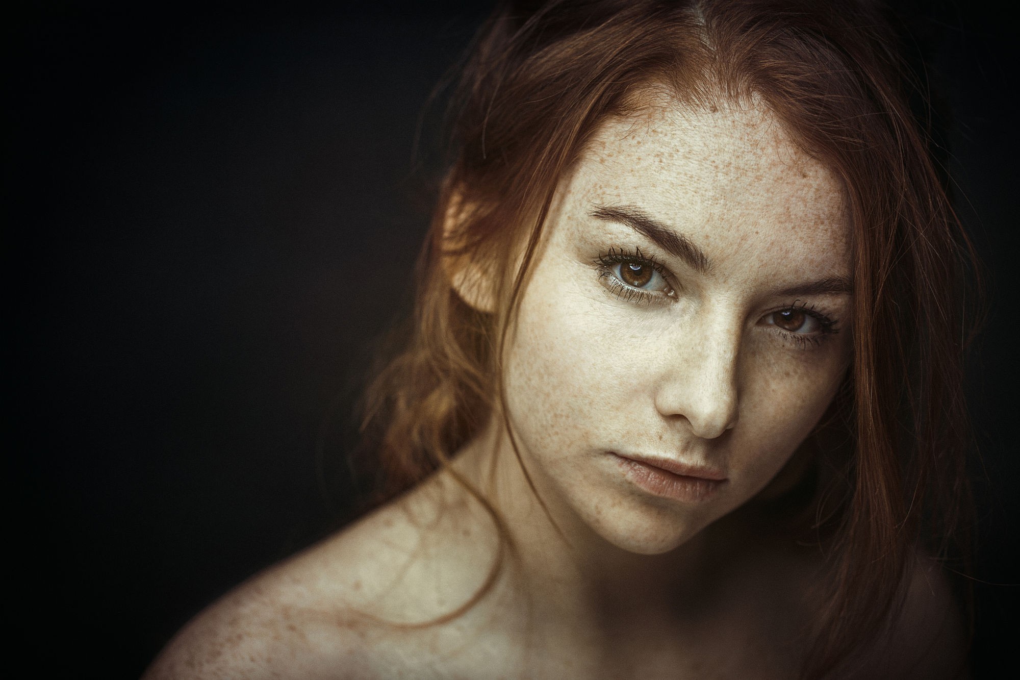 Redhead woman with freckles looking at the viewer HD Wallpaper