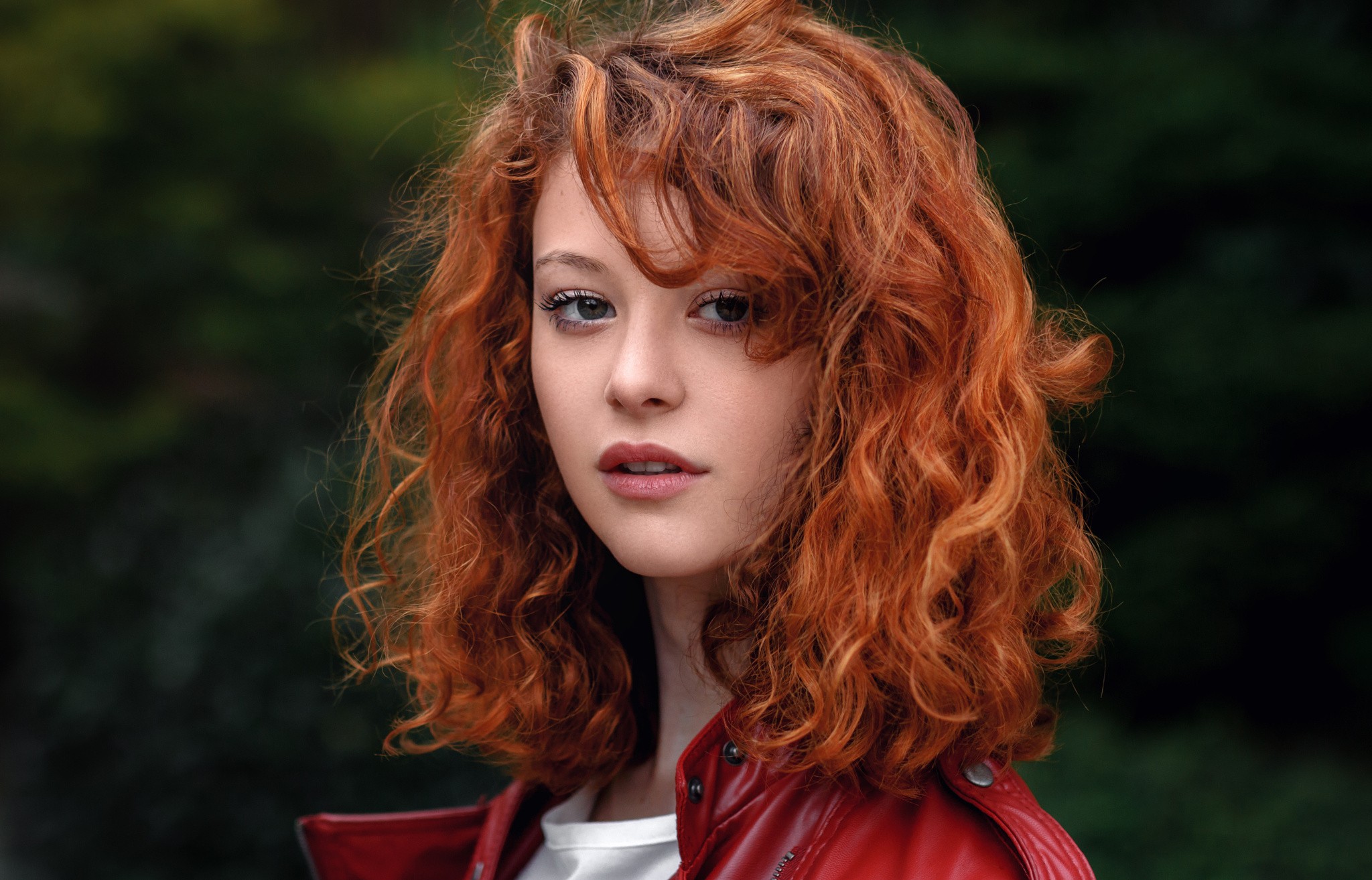 Redhead woman with curly hair in a red jacket HD Wallpaper