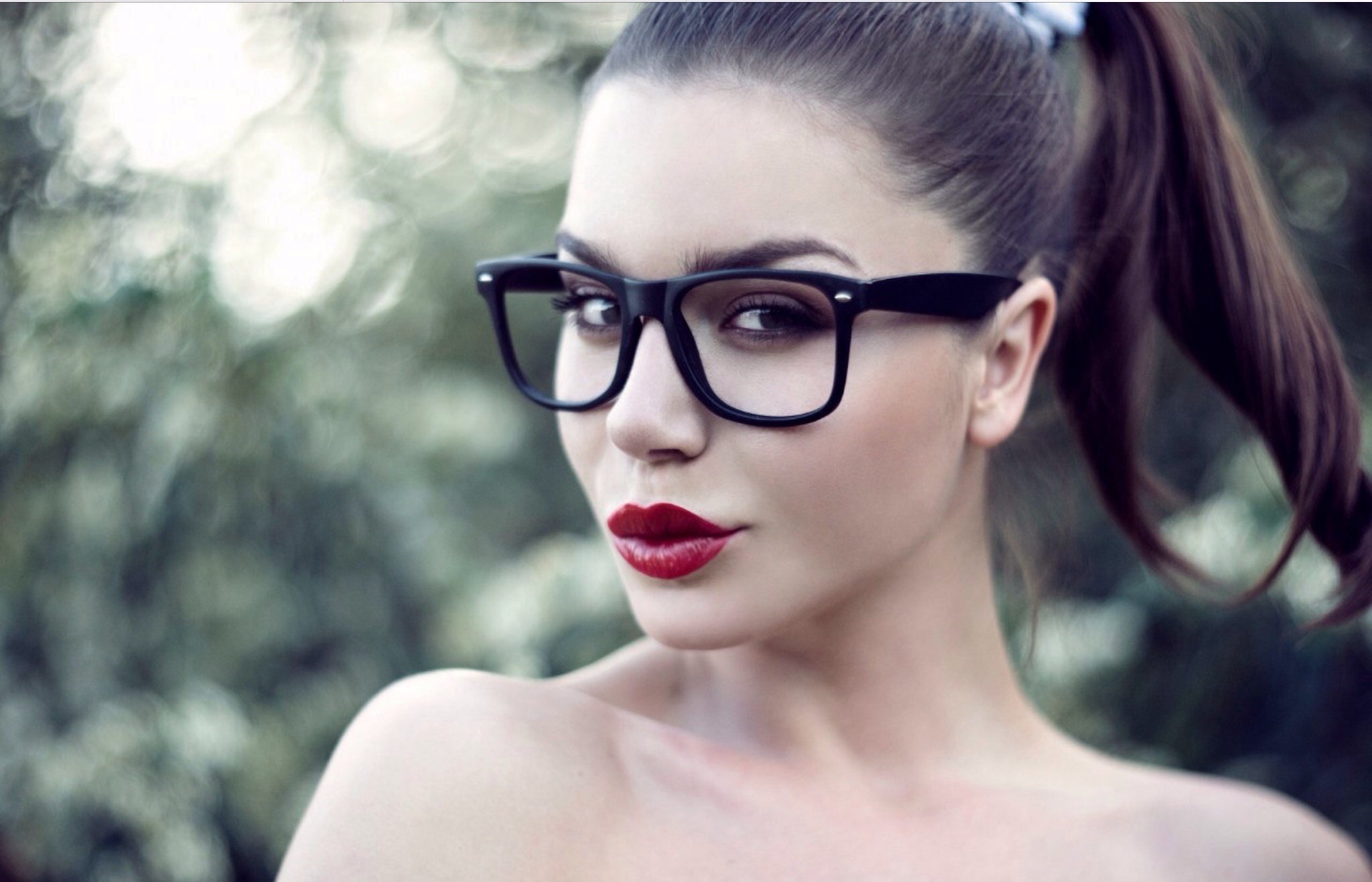 Woman with glasses and red lipstick in a ponytail HD Wallpaper
