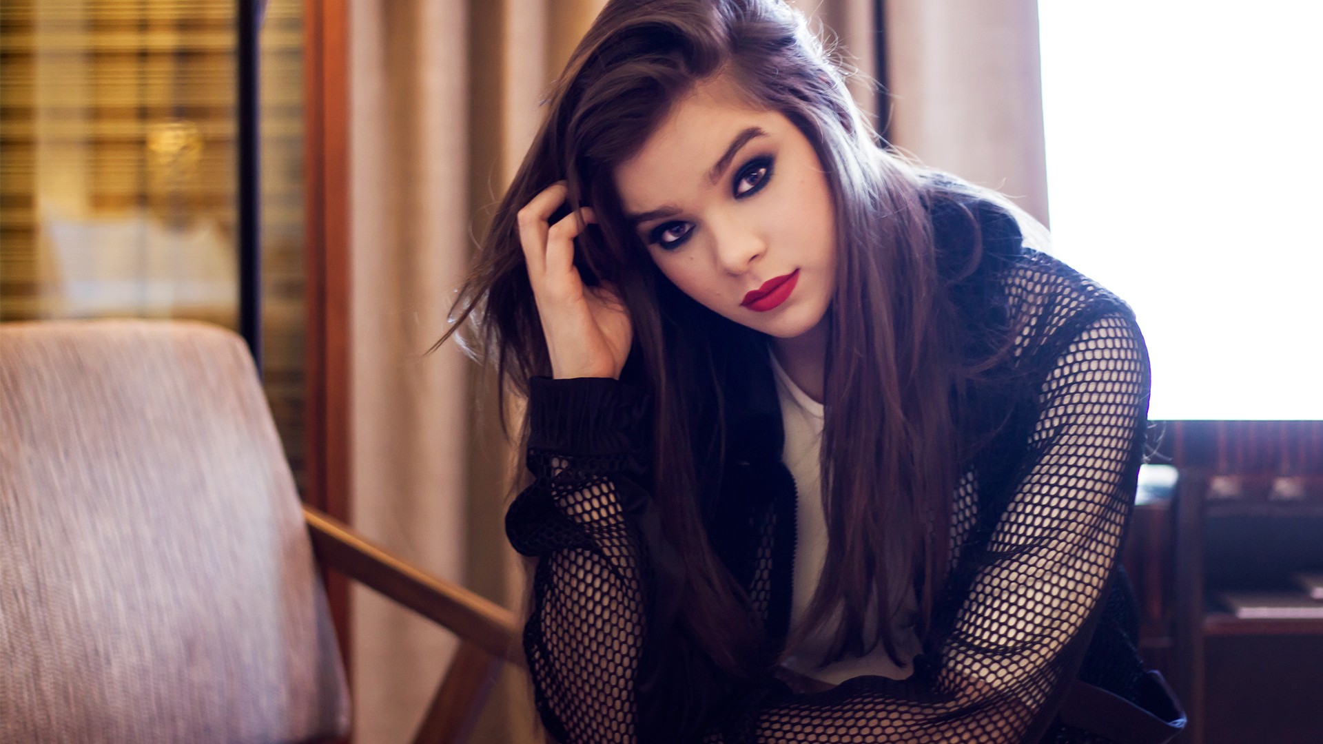 Hailee Steinfeld posing in a black mesh jacket HD Wallpaper