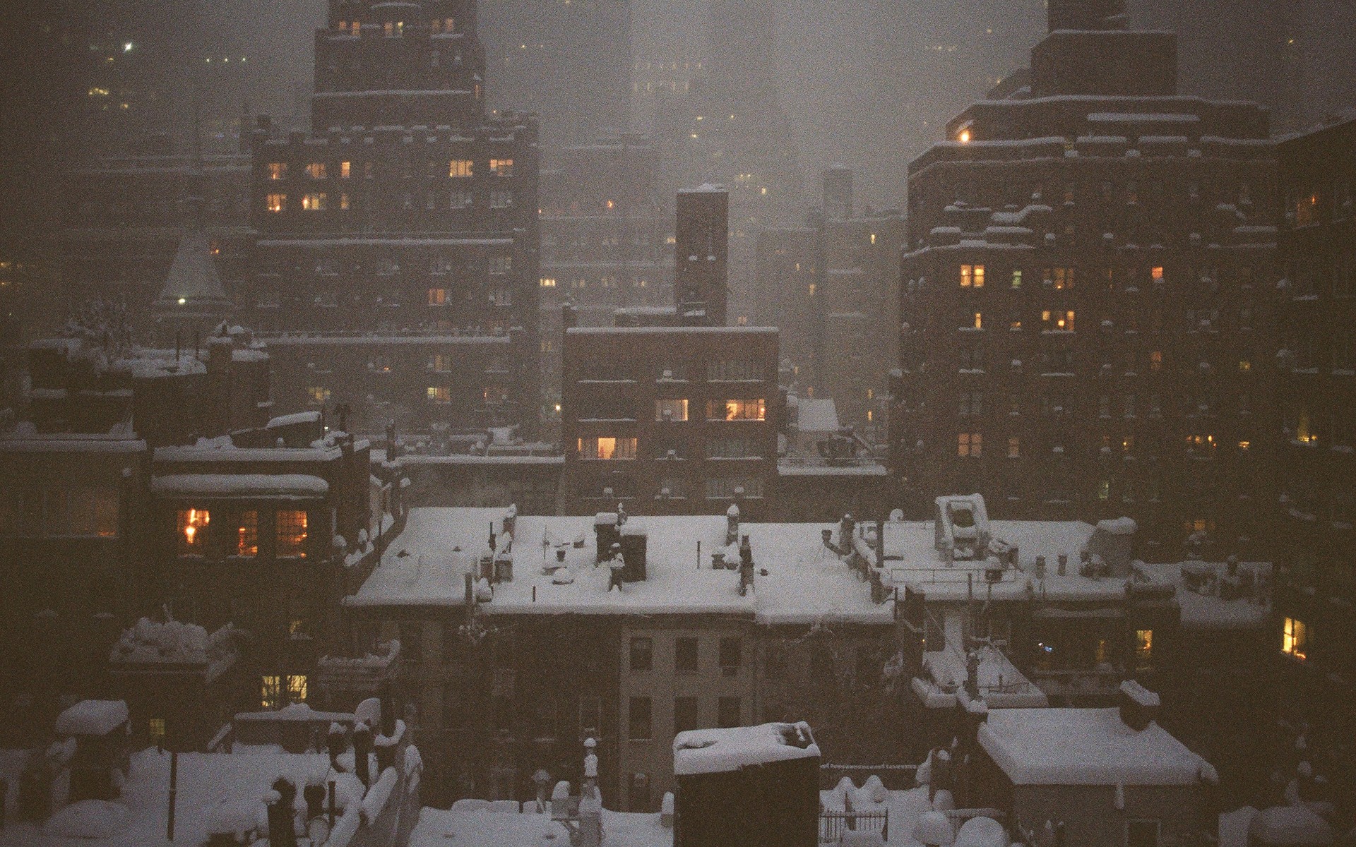 Snowy city skyline at night HD Wallpaper