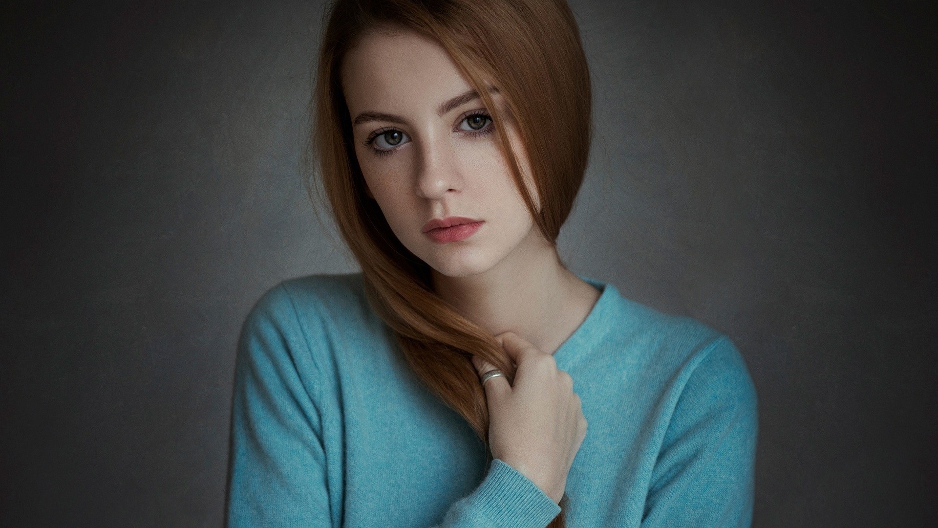 Woman with auburn hair wearing a blue sweater HD Wallpaper