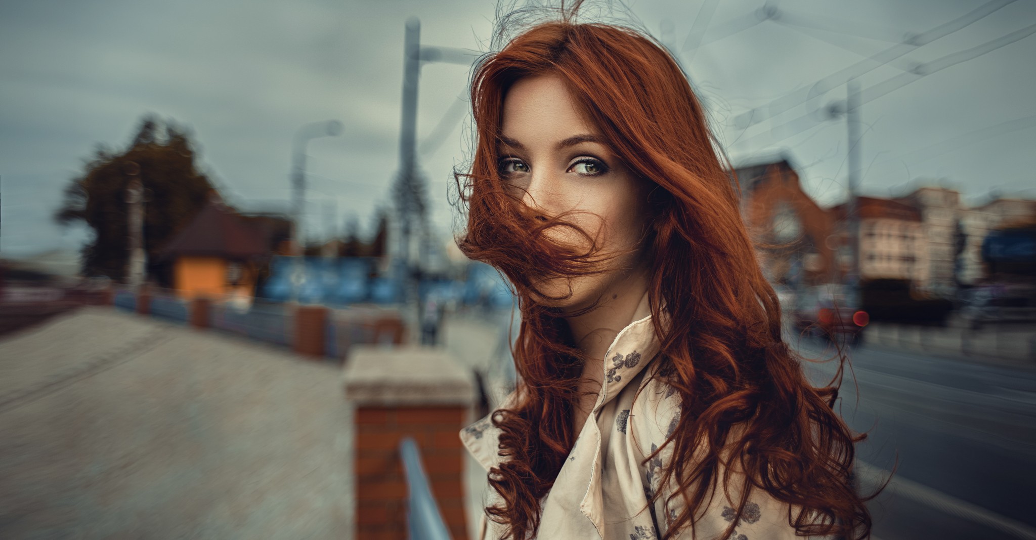 Redhead woman with windblown hair looking at the camera HD Wallpaper