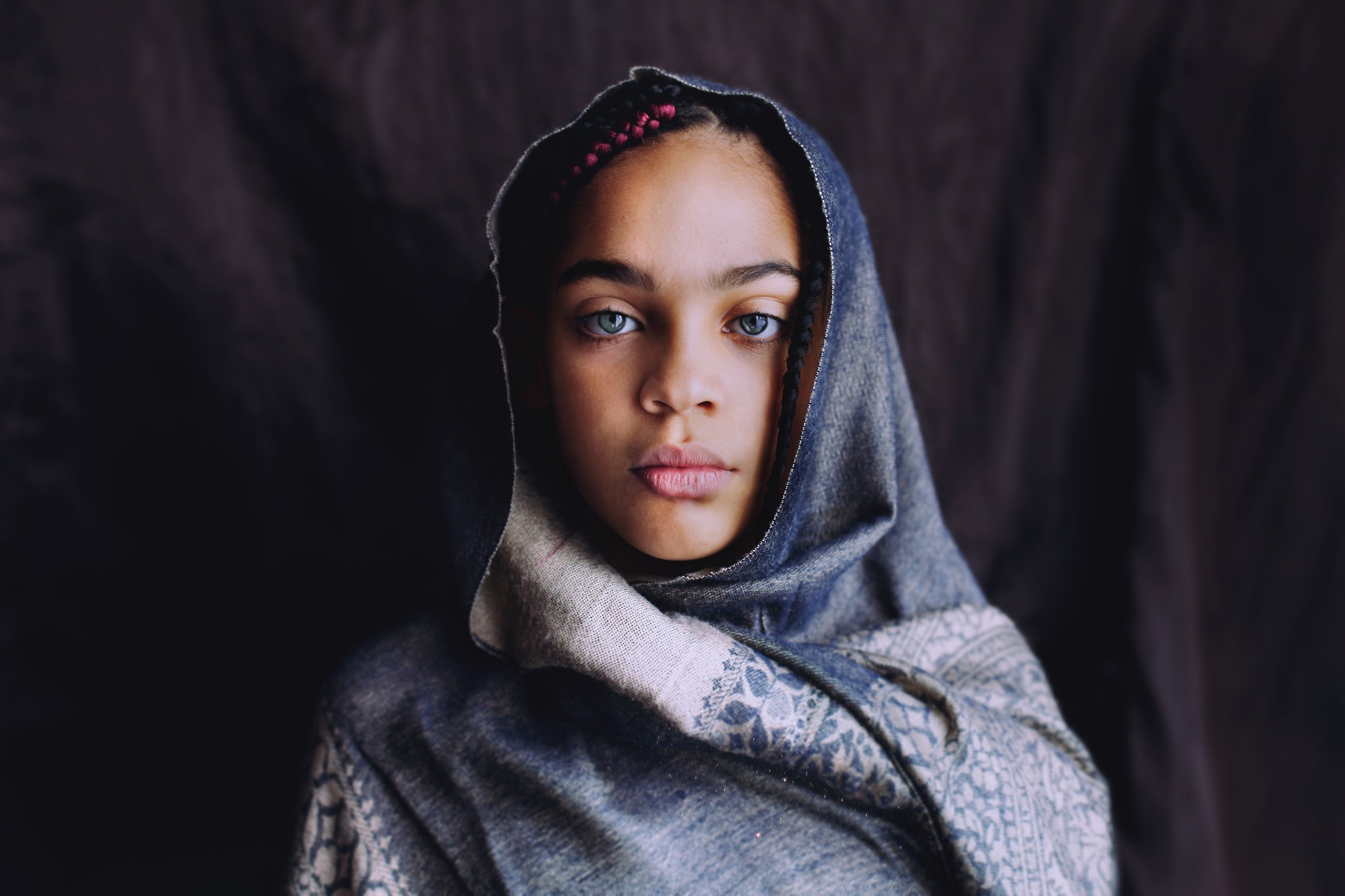 Portrait of a young woman with blue eyes wearing a headscarf HD Wallpaper