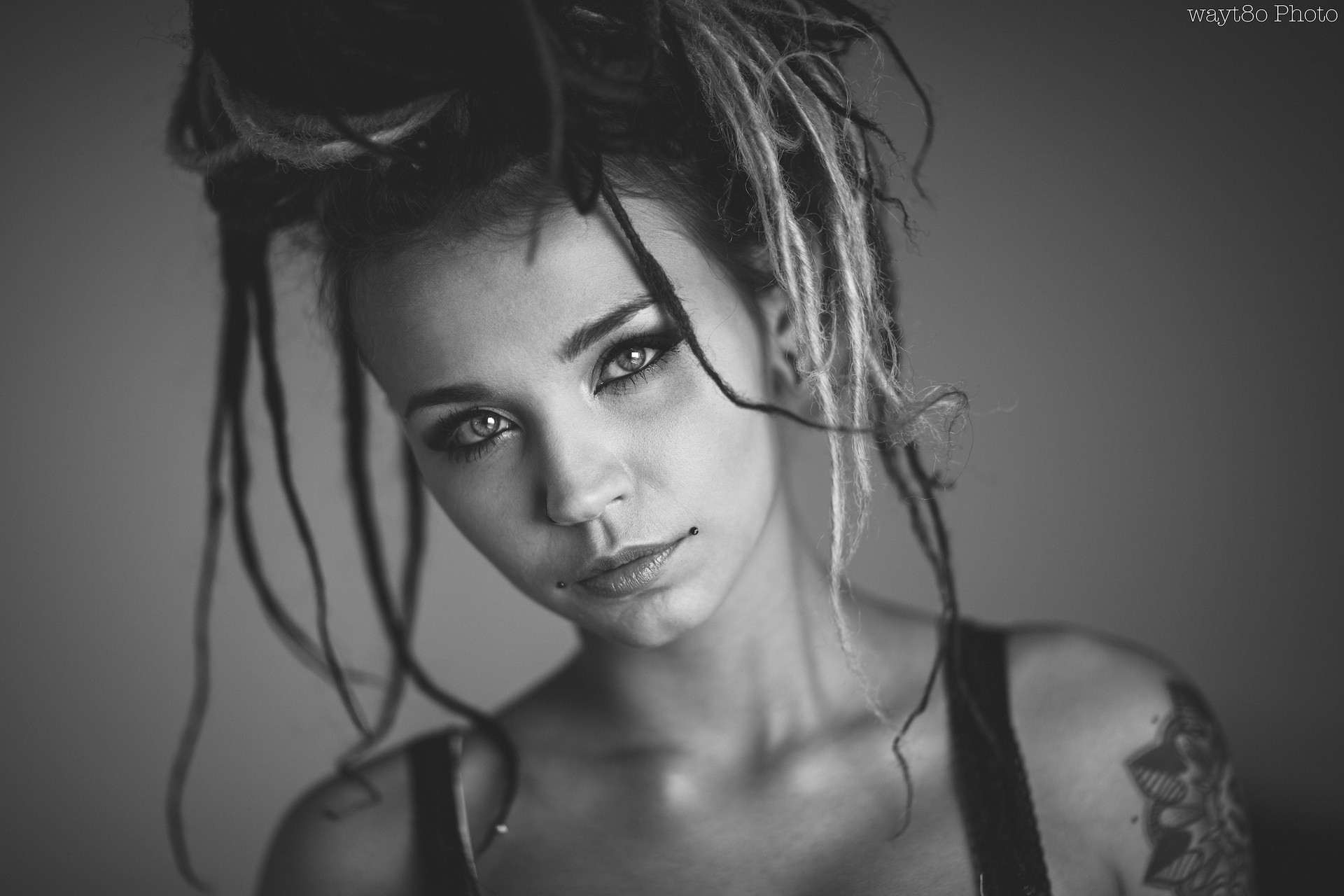 Woman with dreadlocks and piercings HD Wallpaper