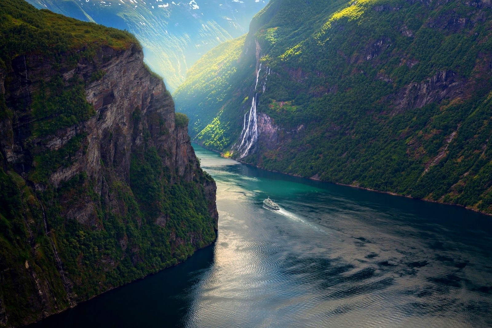 Ship sailing through a Norwegian fjord with waterfalls HD Wallpaper