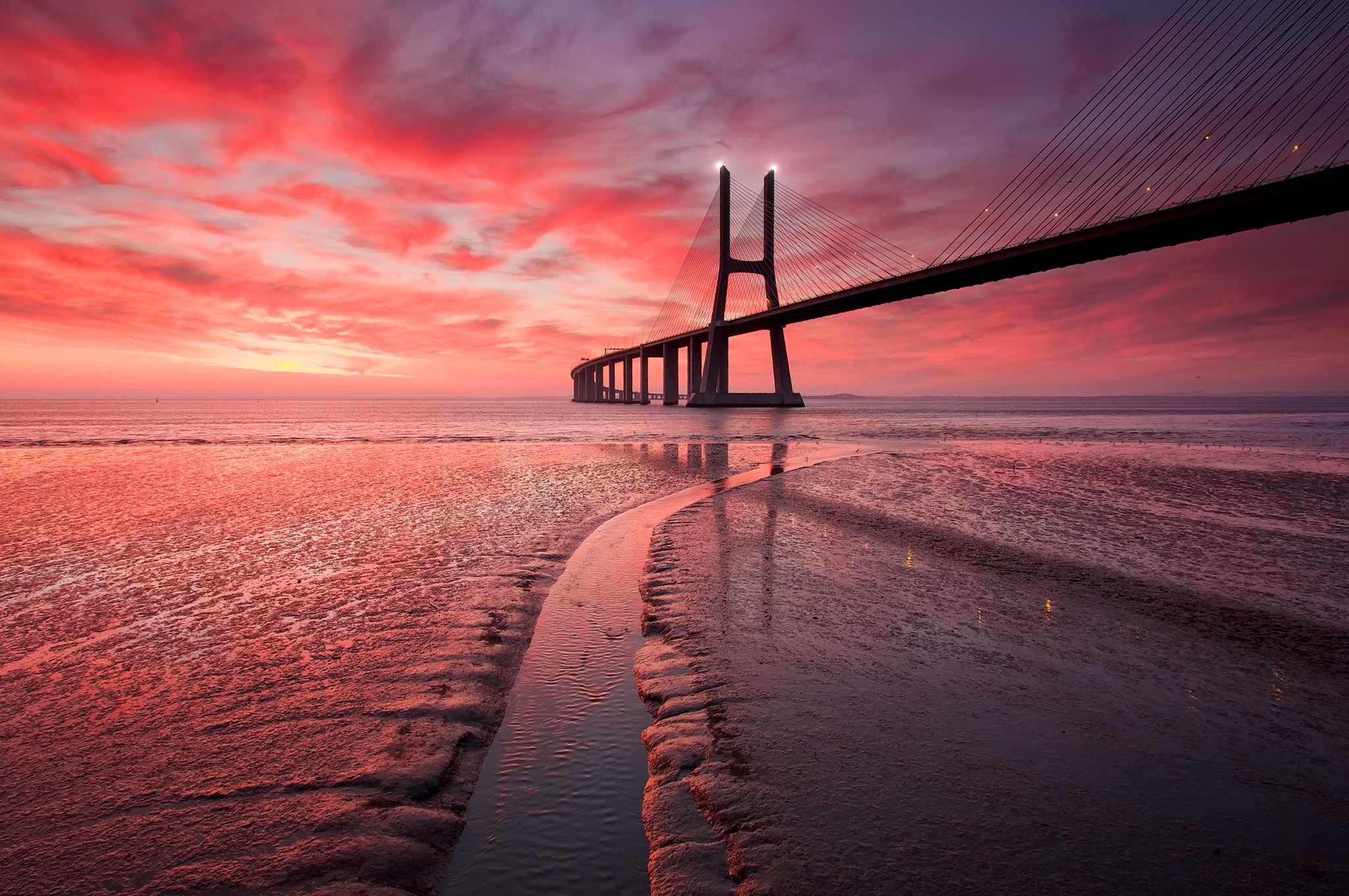 Vasco da Gama Bridge at sunset HD Wallpaper