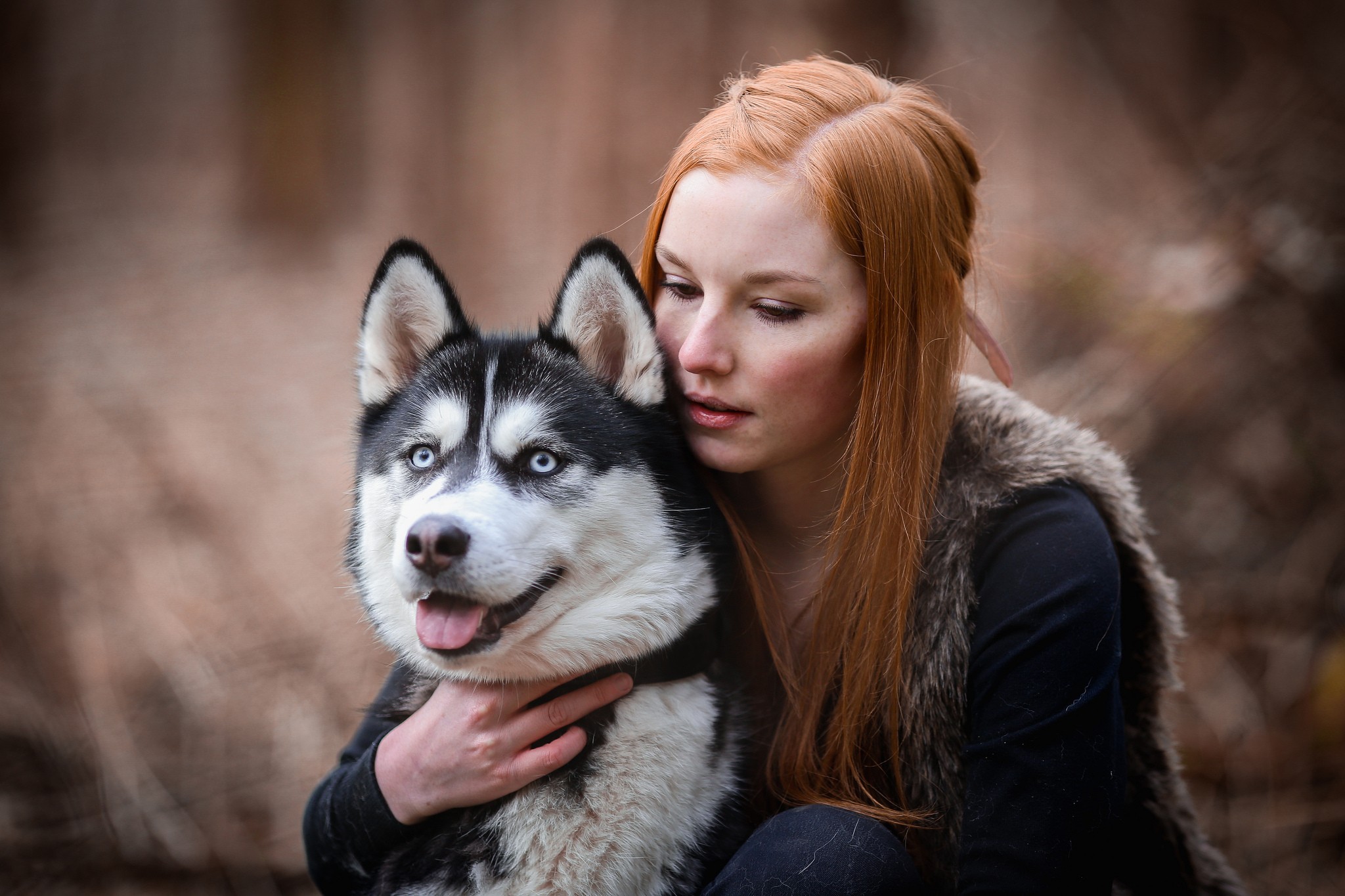 Redhead woman hugging a husky dog outdoors HD Wallpaper