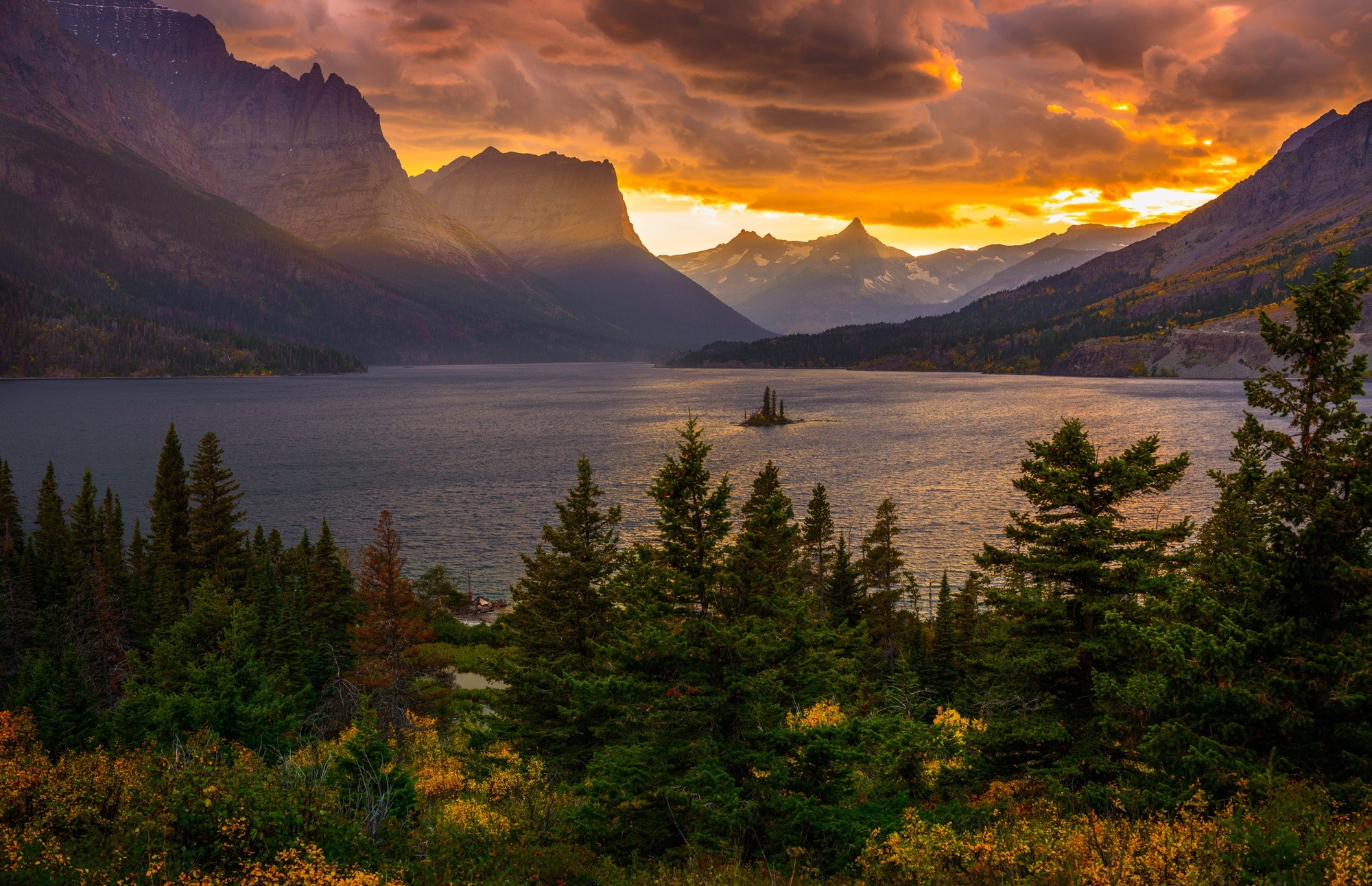 Sunset over mountains and lake with island HD Wallpaper