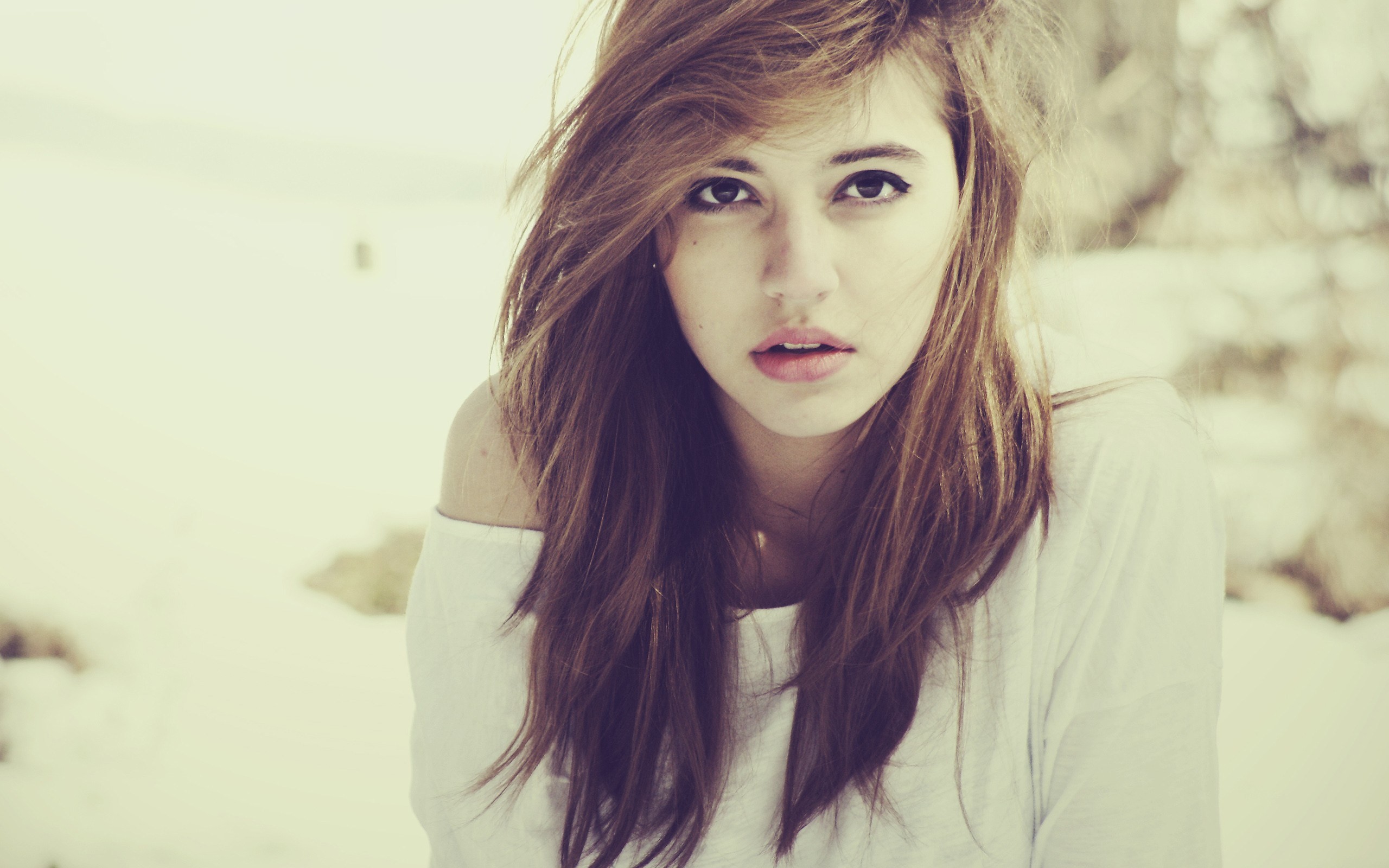 Young woman with long brown hair outdoors HD Wallpaper