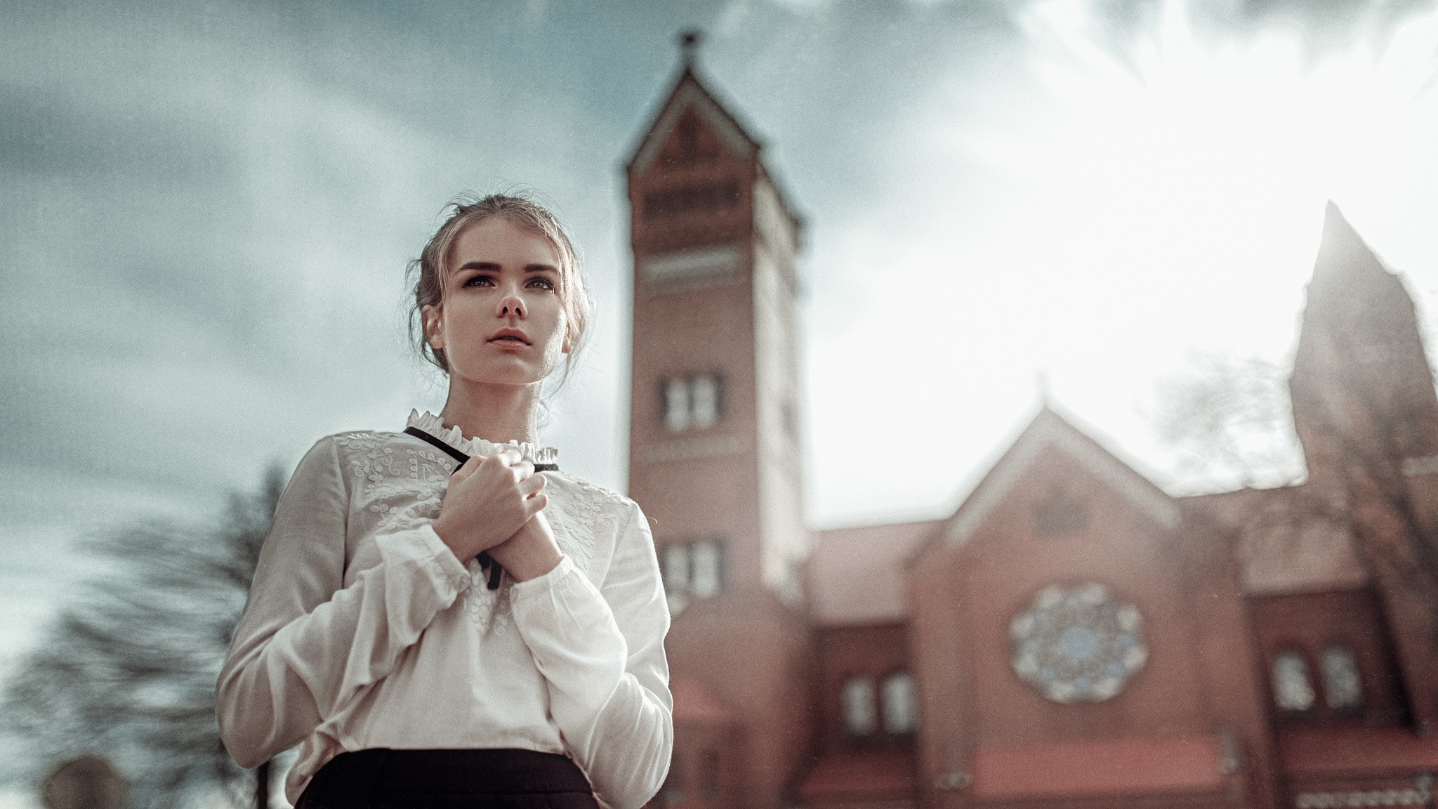 Woman in white blouse in front of a church HD Wallpaper
