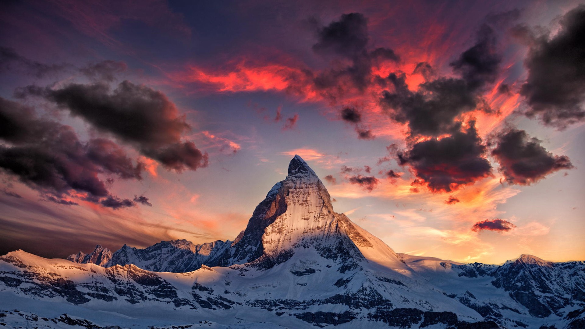 Matterhorn mountain at sunset with dramatic clouds HD Wallpaper