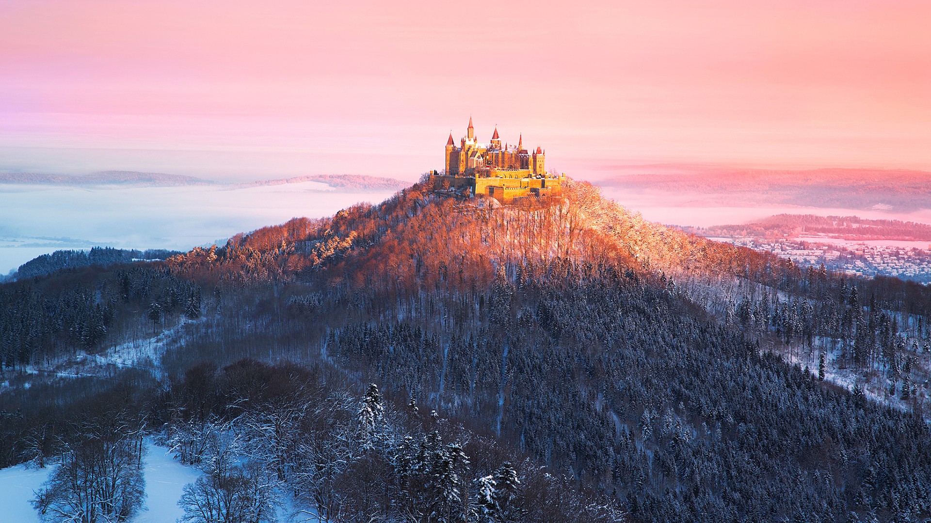 Burg Hohenzollern castle on a snowy mountain at sunrise HD Wallpaper