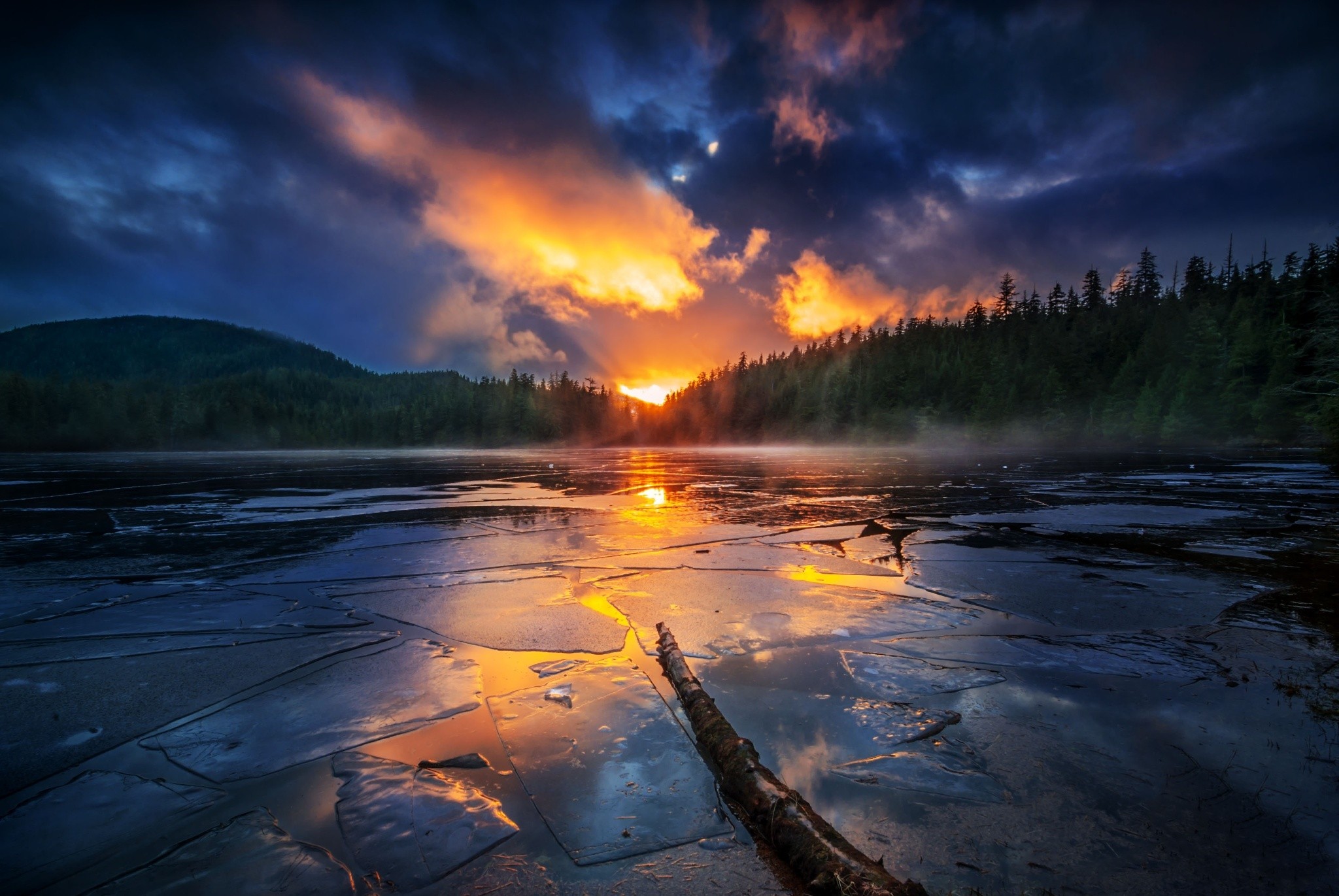 Sunrise over a frozen lake with forest HD Wallpaper