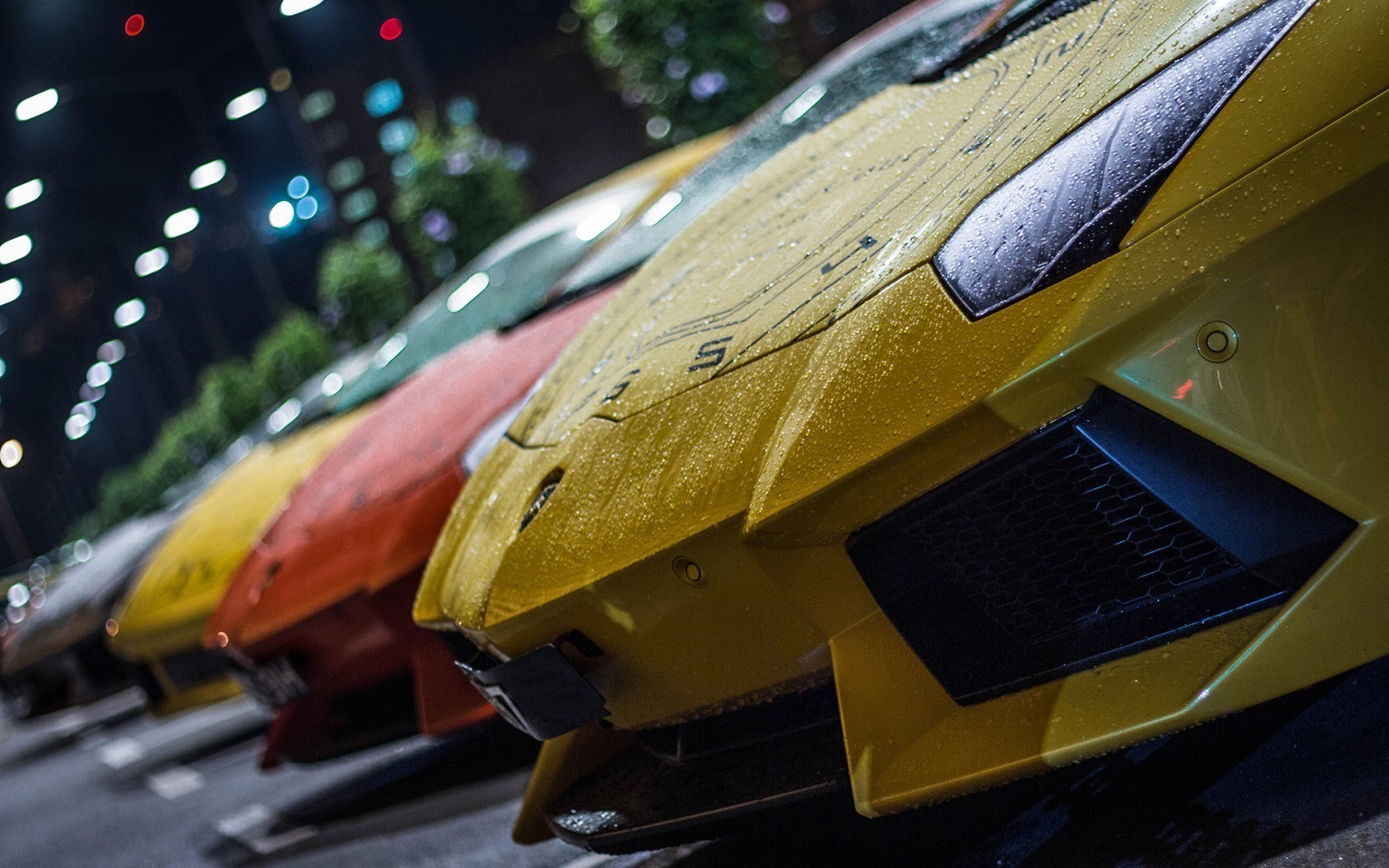 Yellow Lamborghini cars parked in the rain at night HD Wallpaper