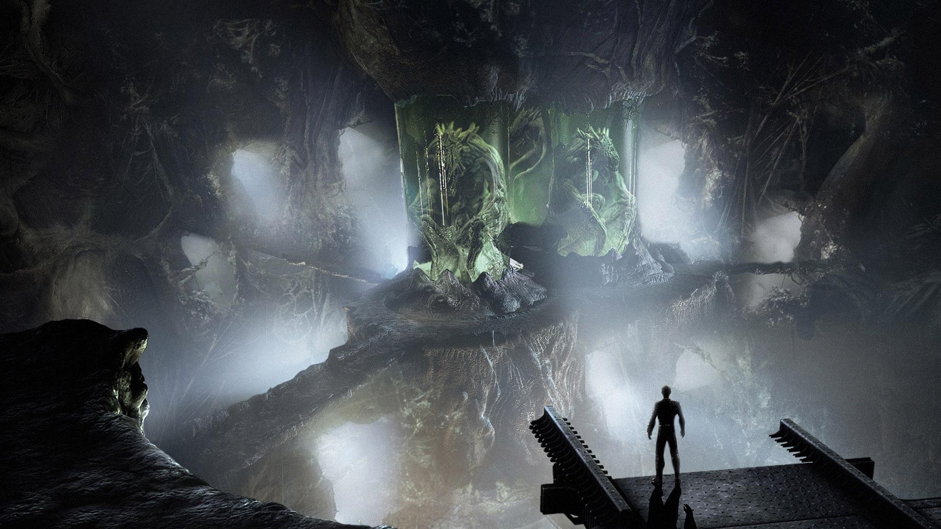 Alien creatures in containment pods in a dark cave HD Wallpaper