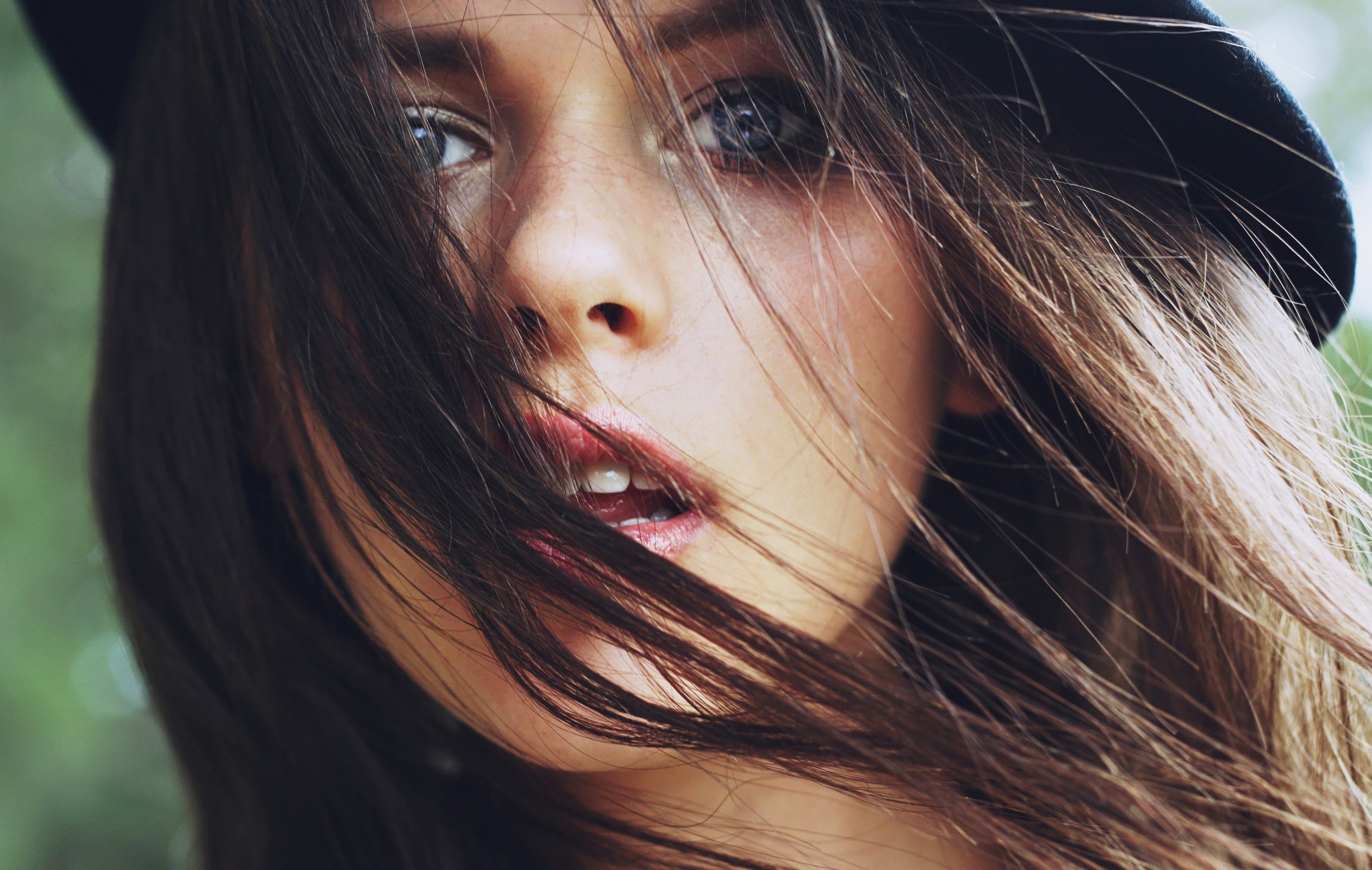 Woman with dark hair and a hat HD Wallpaper