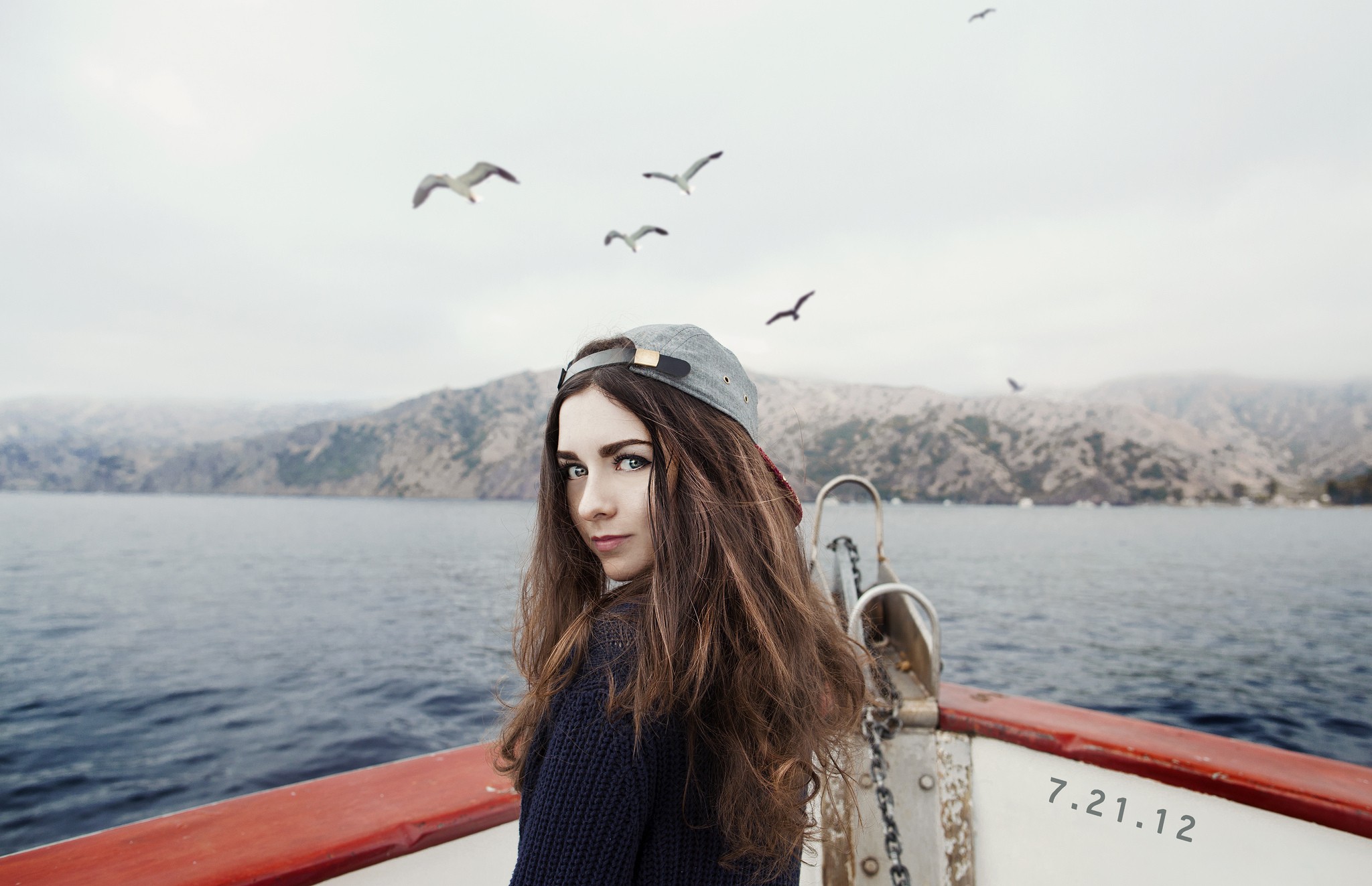 Woman on a boat with seagulls and mountains HD Wallpaper