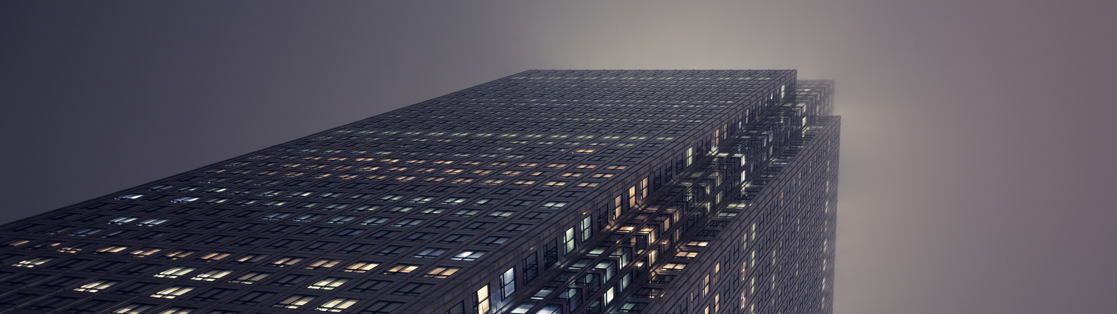 Skyscraper in London shrouded in mist at night HD Wallpaper