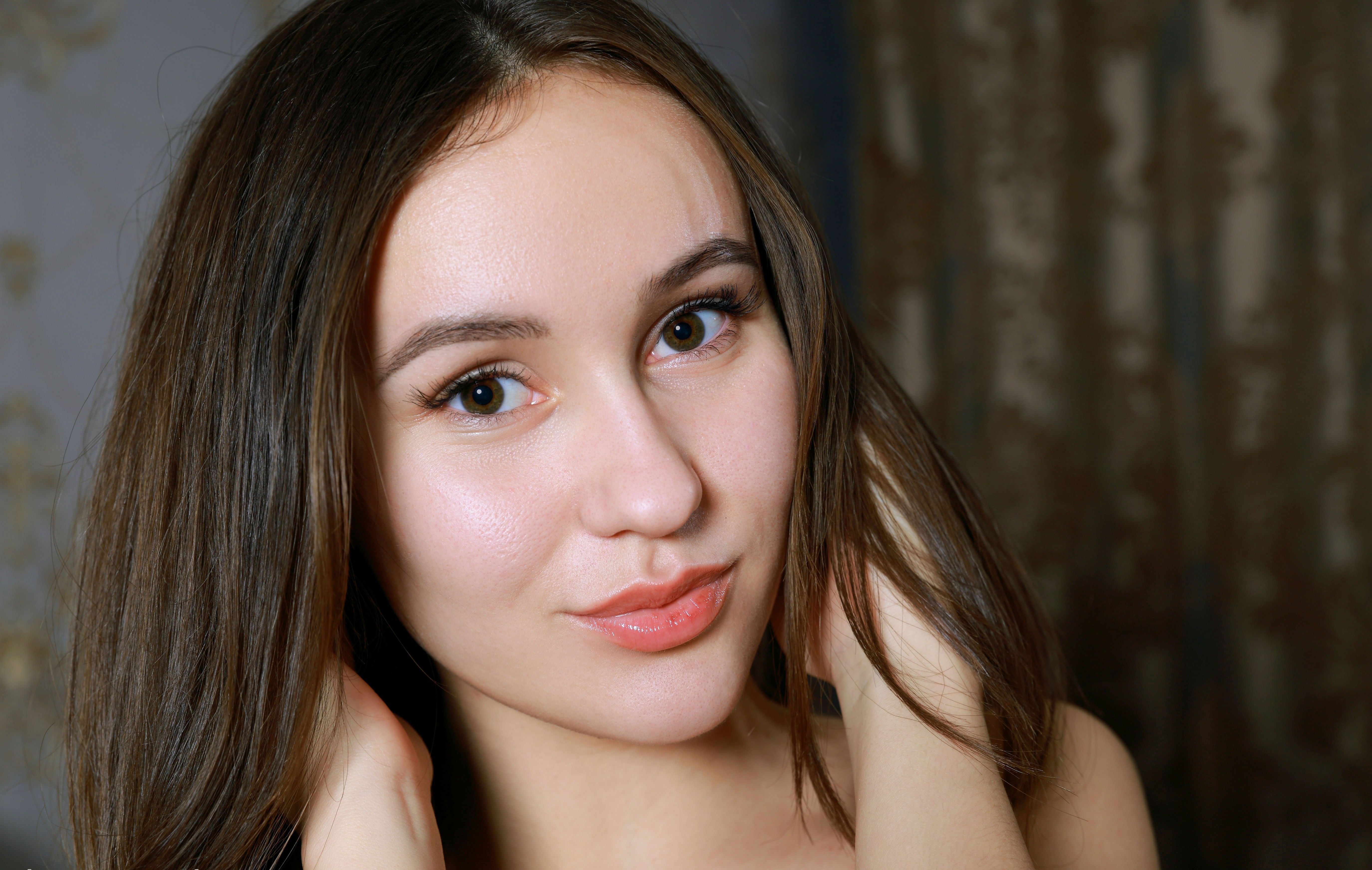 Young woman with long brown hair and brown eyes HD Wallpaper