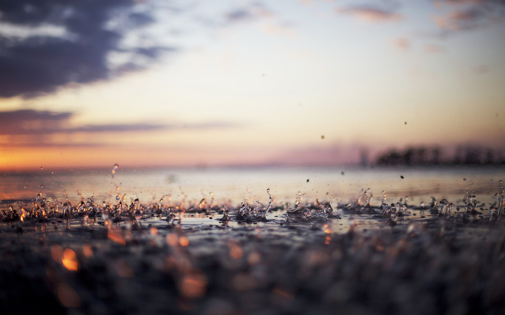 Water drops splashing at sunset with bokeh HD Wallpaper