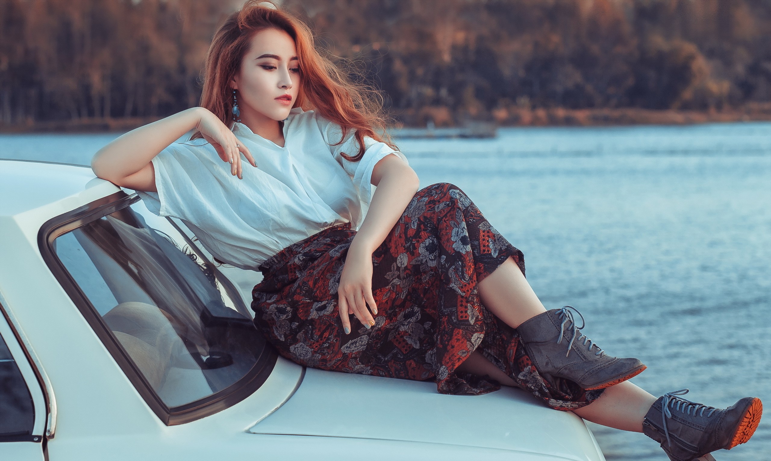 Asian woman sitting on a white car by the water HD Wallpaper