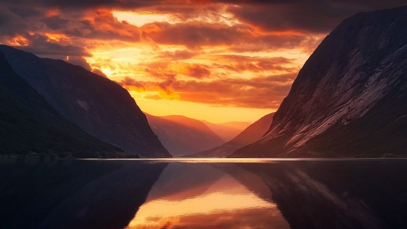 Sunset over mountains and a lake HD Wallpaper