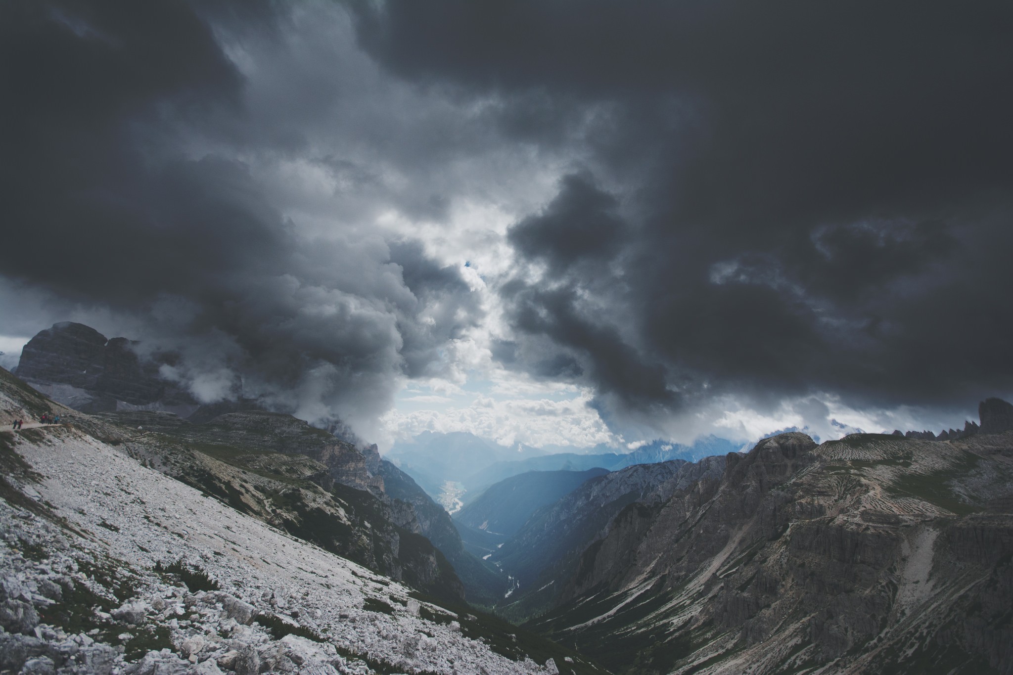 Stormy clouds over a mountain valley landscape HD Wallpaper