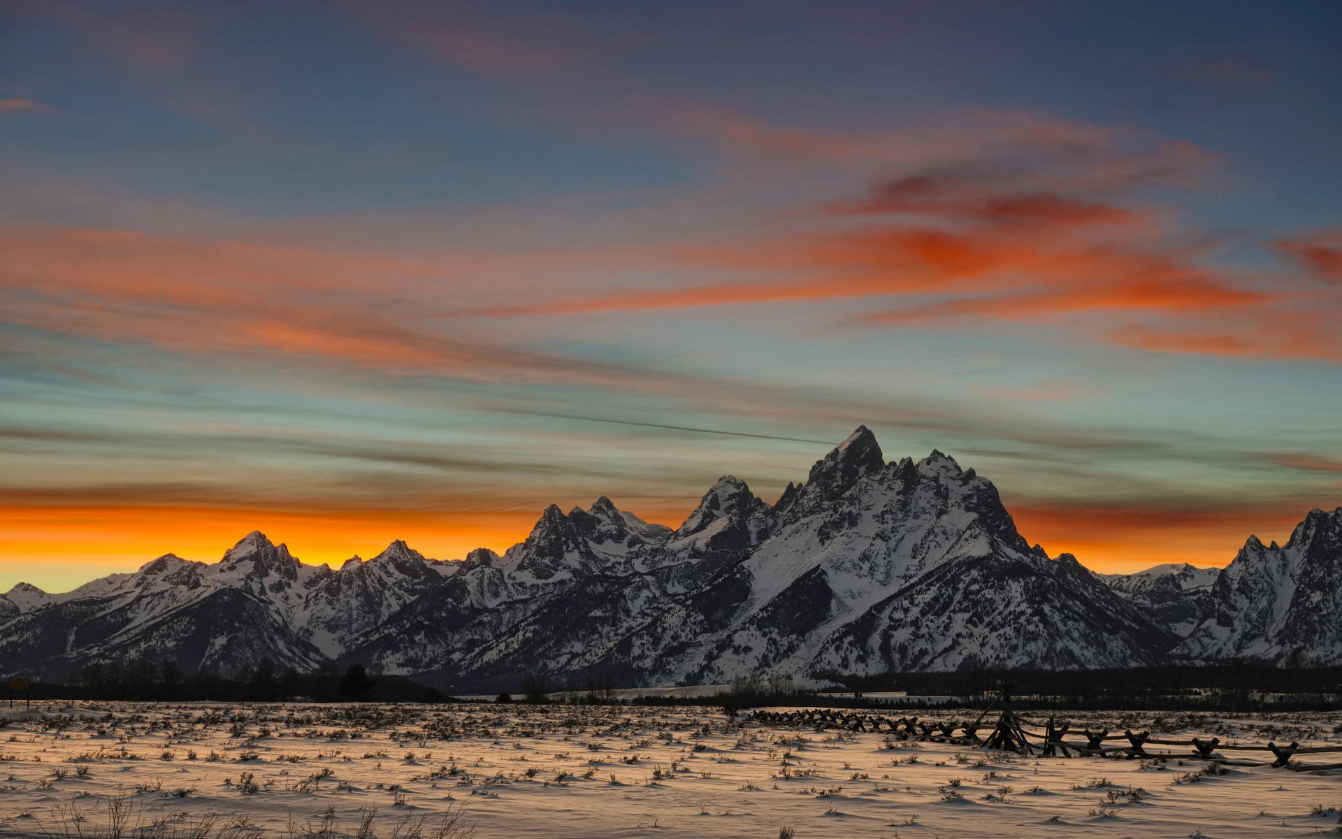 Snow-covered mountains at sunset with colorful clouds HD Wallpaper