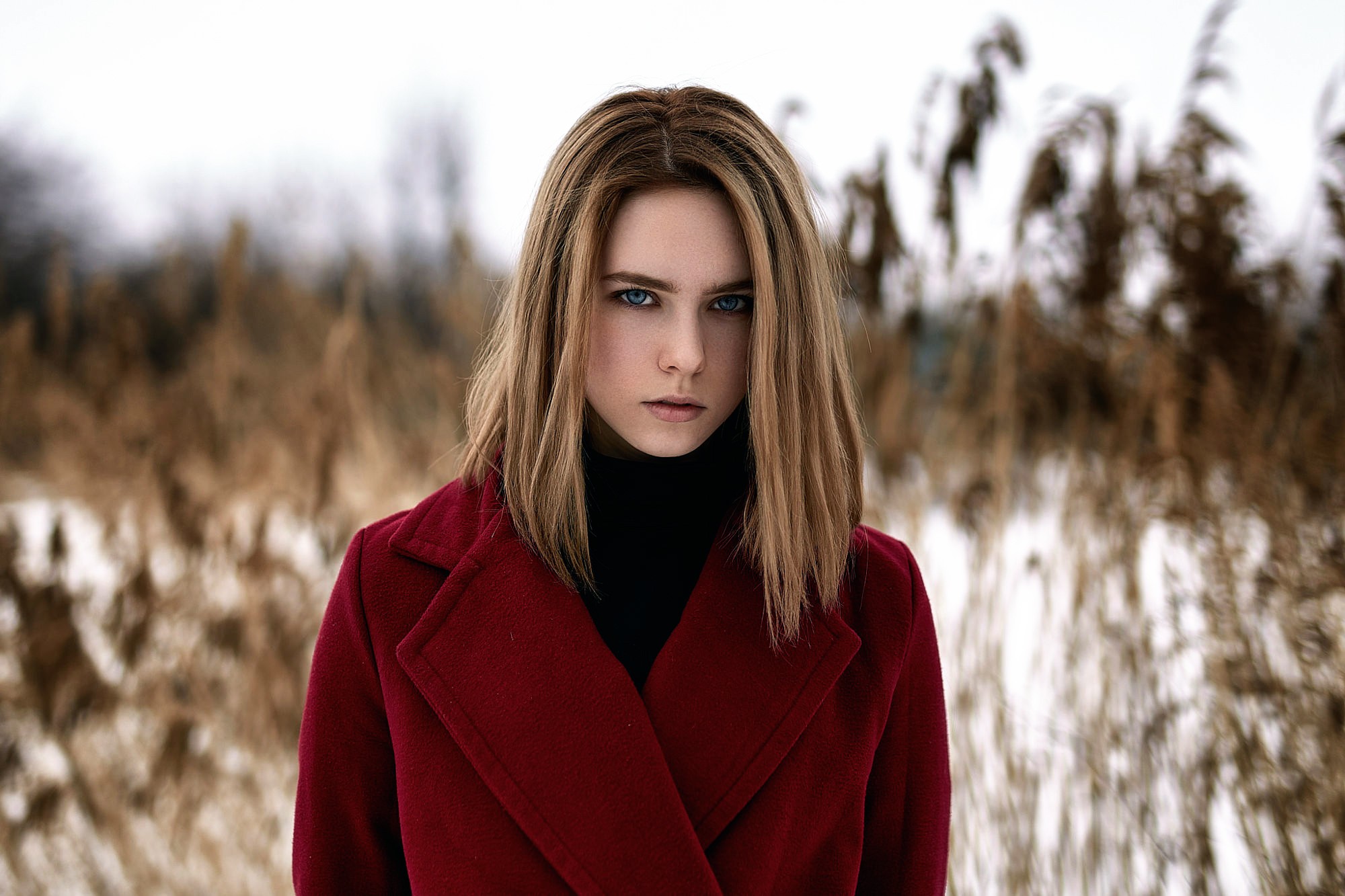 Woman in red coat in a field HD Wallpaper