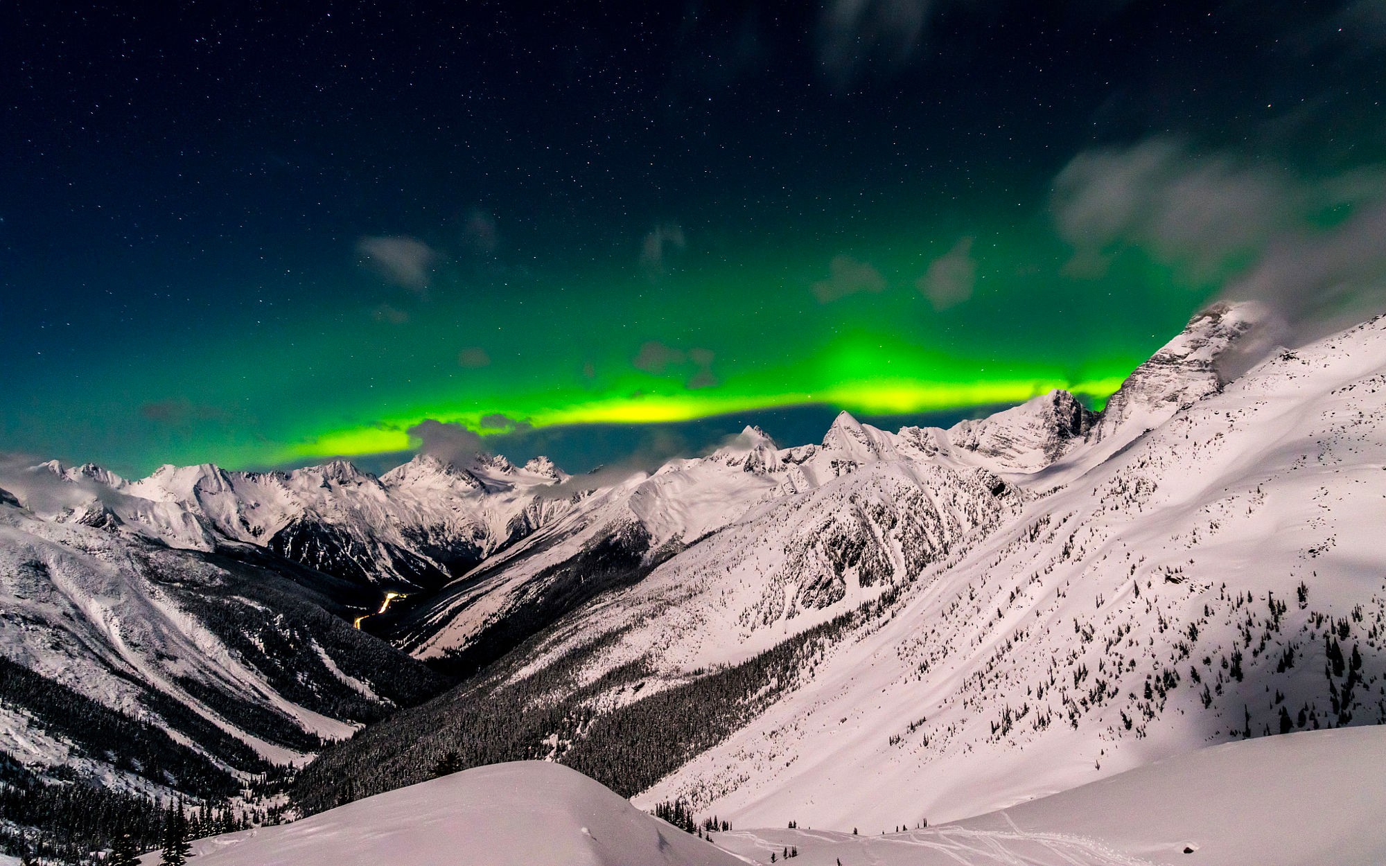 Aurora Borealis over snow-covered mountains in British Columbia HD Wallpaper