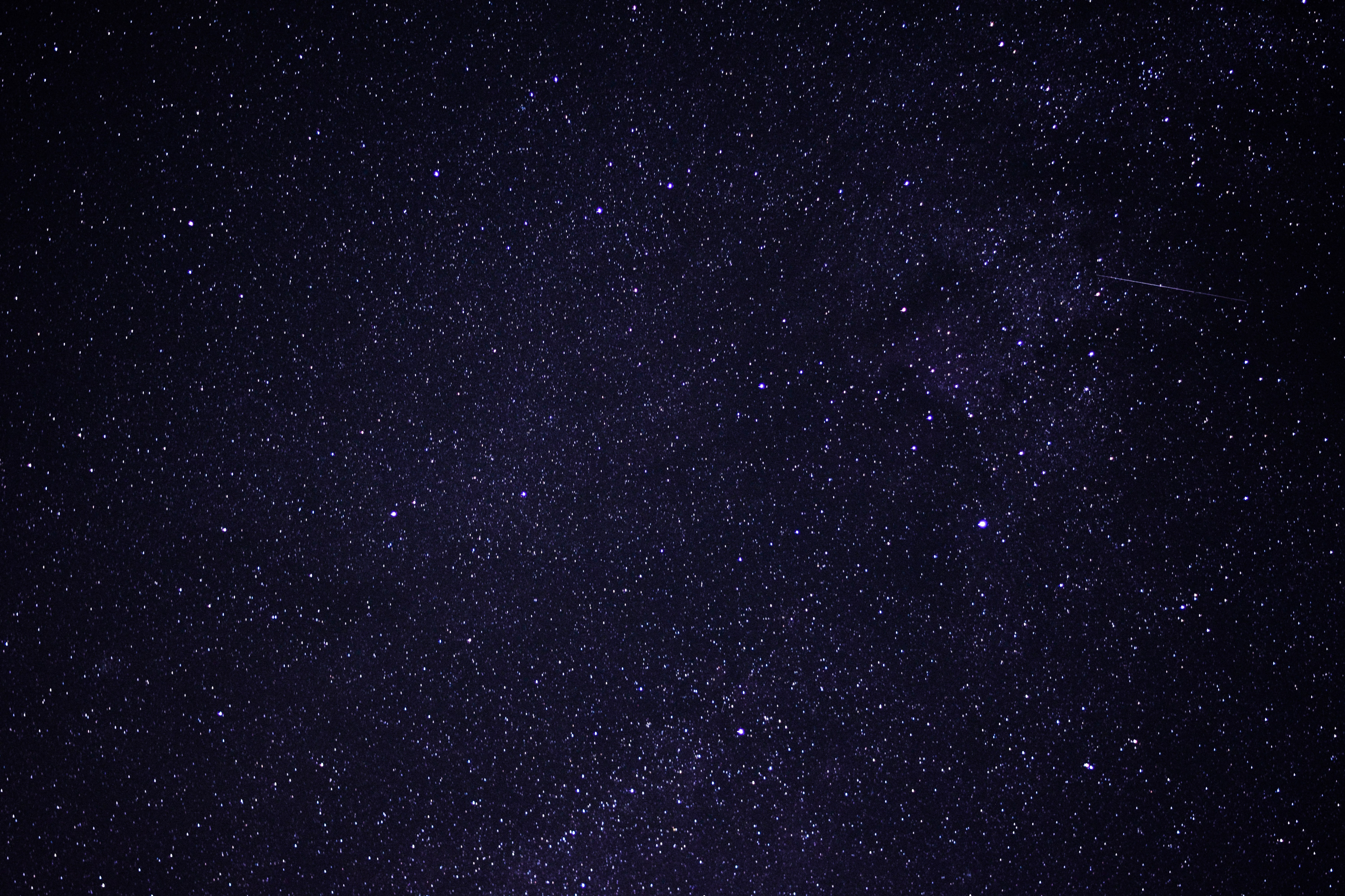 Starry night sky with a meteor shower HD Wallpaper