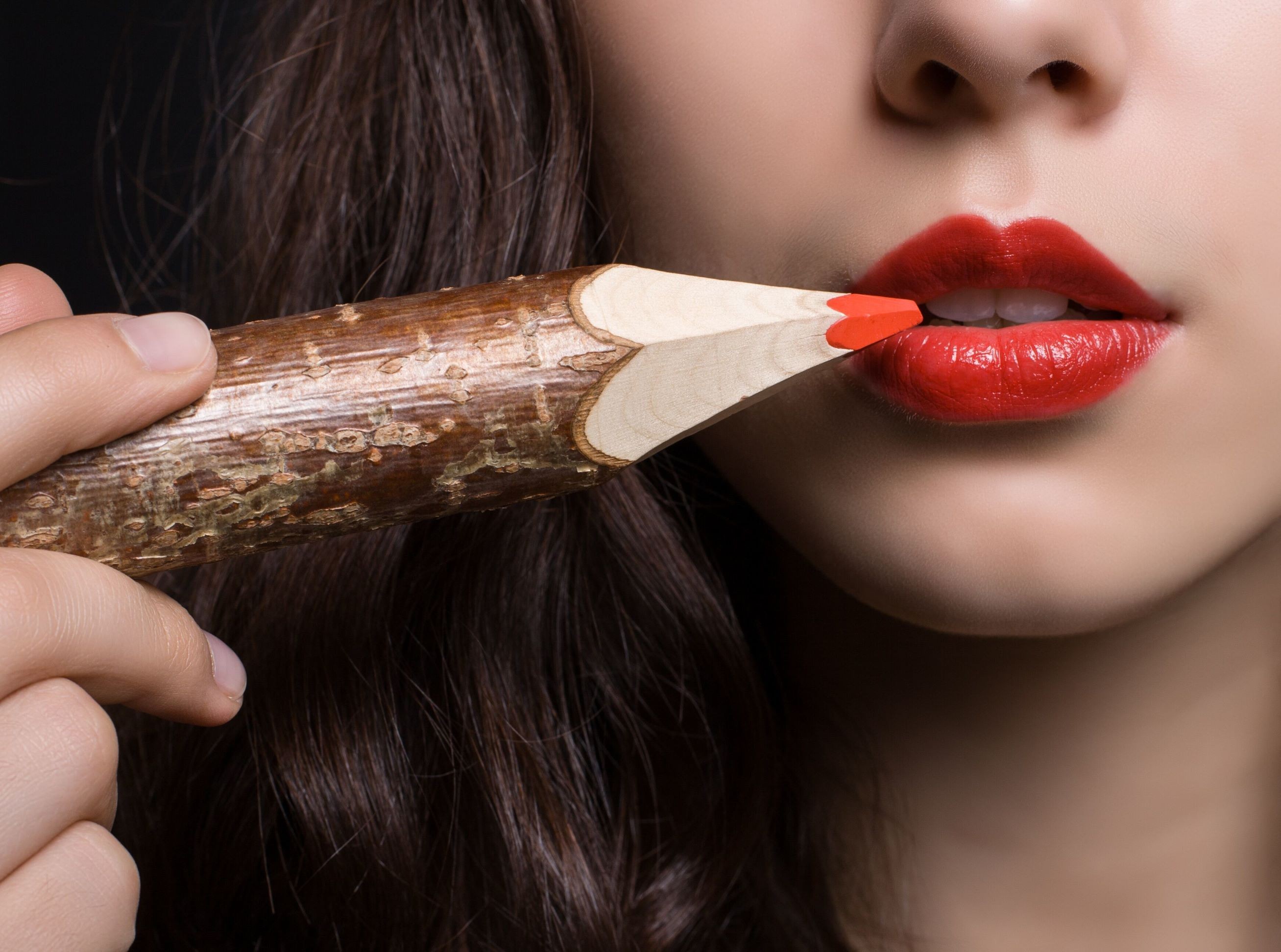 Woman with red lipstick and a wooden pencil HD Wallpaper