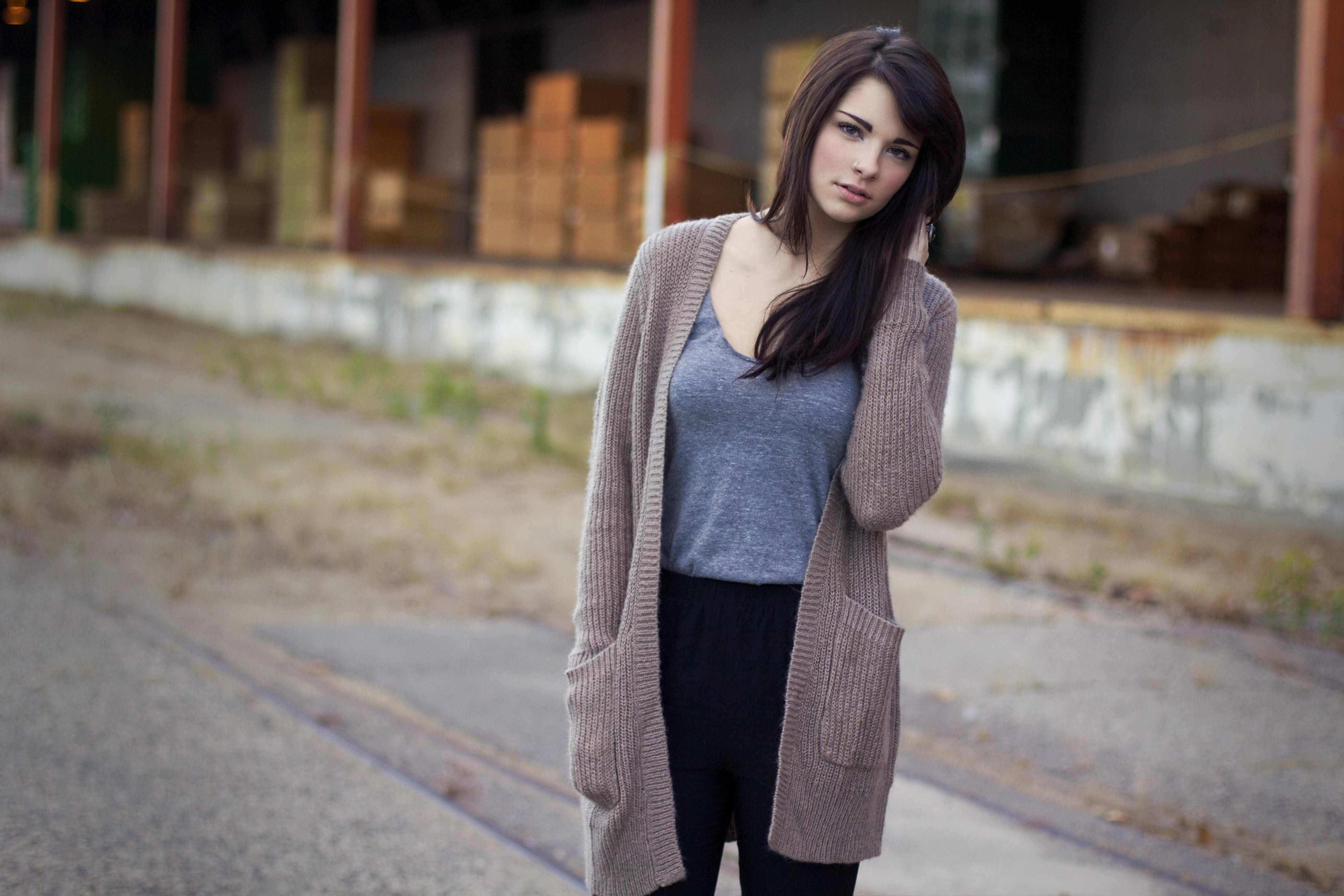 Woman in cardigan and black pants outdoors HD Wallpaper